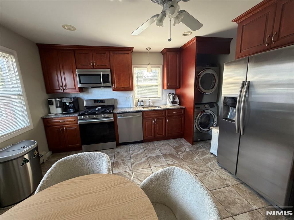 Beautiful Bright 2 Bedroom 2nd Floor Apartment in a 2 Family Home, Residential Neighborhood , New Kitchen with SS Appliances including Dishwasher, Refrigerator and Microwave, Large Rooms with Closets, Central Air and Baseboard Heat, Washer and Dryer in Unit