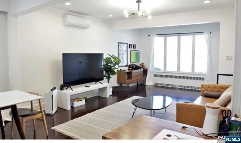 Sunny, bright and Rarely found, totally renovated 2 story (1ST FLOOR & GROUND) 1-bedroom, 2 full bath rental with a finished ground-level basement. Main level features an open living room & dining area, granite kitchen, and stainless steel appliances. Spacious bedroom with walk in closet and updated full bath on the first floor. Interior stairs lead to a fully finished basement with recreation room, full bath, washer & dryer, storage, and separate entrance. Private deck and backyard access included. Parking includes 1-car garage + 2 tandem driveway spaces/ Front & Back. Conveniently located near NYC bus, shopping, schools, restaurants, Food Bazaar and more. Tenant pays gas and electricity (shared gas meter â€“ 2/3 responsibility). Cold water included. .HOT WATER HEATING SYSTEM AND DUCTLESS COOLING . Cherry finished wood floor through. White cabinet in the dining room shall be staying As Is Condition . No pets. No smoking. NTN credit report, proof of income, and certified funds required 1.5-month security deposit + first monthâ€™s rent due at lease signing. Some pictures from previous occupancy.