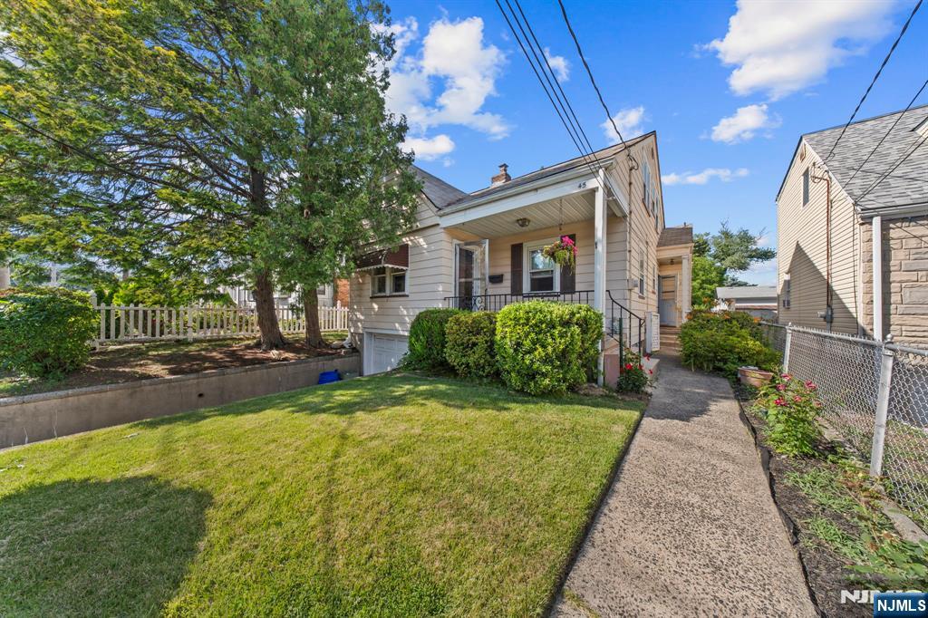This bright, airy 4-bedroom, 2-bath Cape Cod offers easy living with a full basement and built-in 1-car garage. The expansive yard is perfect for entertaining, gardening, or play. A solid, versatile home with tons of potential and space to grow.