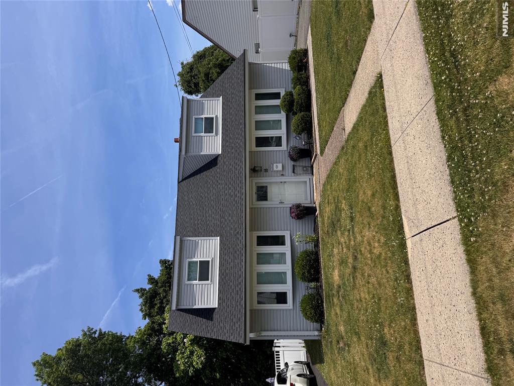 Welcome to this move-in ready 3 BR, 1.1BTH Cape Cod home, perfectly situated on one of the area's most desirable and picturesque streets. Thoughtfully renovated throughout, this charming home combines modern updates with timeless appeal. The bright and inviting interior features LR, DR, updated kitchen and comfortable bedrooms designed for everyday living. A two-car detached garage provides convenience and plenty of storage space. Recent improvements include: New Furnace (2025), Newer HWH (2021), New Roof, Siding, Storm Door, Front Door (2024), Hardwood Floors (2016). Kitchen (2017). Conveniently located near NYC transportation, schools, shopping and major highways!