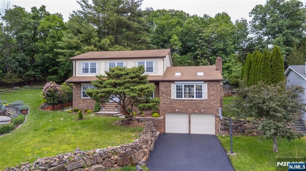 This Well Maintained Colonial sits on a quiet cul-de-sac with large rooms through-out. Spacious eat-in kitchen with island, 6 burner Viking Stove & plenty of cabinet space. Dining area leads to a backyard, great for entertaining with deck, paver block patio and an above the ground pool. Cathedral ceilings in family room along with formal living room, formal dining room and office/den. Recently updated primary bath & custom finished walk in closet. Full finished basement with large storage room. Whole House Water Pruification System, nicely landscaped, close to shopping, NY, NJ Transit & Houses of Worship