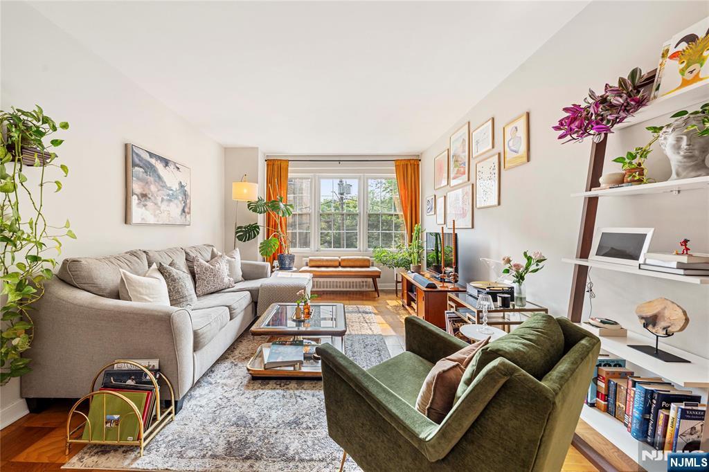 Own a slice of charming Montclair! This unique and beautifully maintained 1-bedroom condo blends vintage charm with everyday convenience in the heart of one of NJâ€™s most desirable towns. Step through a marble-tiled lobby and into a warm, homey condo featuring classic parquet wood floors, a cozy dining room area, and a sun drenched living room! The updated kitchen features warm wood custom cabinetry, playful green mosaic backsplash, and a newly updated breakfast bar. The spacious bedroom offers ample closet space, while the vintage-style bathroom adds a touch of charm with its original details. Enjoy added perks like a deeded garage parking spot, in-building washer/dryer steps away from the unit, assigned storage space, elevators, and evening doorman service. Enjoy sweeping views of New York City and Montclair from the rooftop terrace! Recent updates to the home include the breakfast bar, custom closets, interior doors, and light fixtures. Live just steps away from the buzz of downtown Montclair's Wellmont Plaza, Church Street, and revived Lackawanna Station! With the NJ Transit train station only minutes away, this is city-meets-suburb living at its finest. This is an ideal match for anyone looking to enjoy the best of Montclairâ€™s culture, dining, and excitement, all while tucked into a uniquely charming space that feels like home!