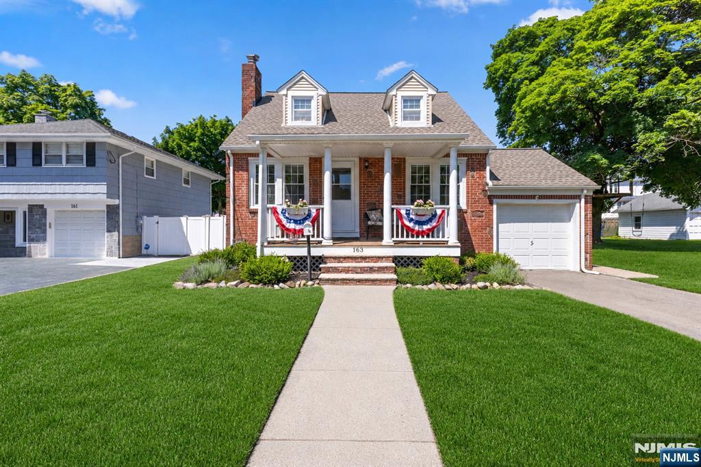 Welcome to this beautifully maintained Cape Cod that perfectly combines timeless charm, thoughtful updates, and exceptional pride of ownership. Featuring 4 bedrooms and 2 updated full bathrooms, this move-in-ready home has been meticulously cared for and offers comfortable living both inside and out. The main living areas showcase hardwood floors and abundant natural light, while the renovated kitchen serves as the heart of the home with modern finishes and functionality. Just off the kitchen, an enclosed sunroom provides the perfect space to relax, entertain, or enjoy your morning coffee year-round. The flexible floor plan offers four bedrooms and two updated full baths, including a second full bathroom located in the full unfinished basement. The basement also includes a laundry area and provides excellent storage space or future finishing potential. Outside, enjoy a fenced backyard ideal for recreation, pets, gardening, or entertaining. A one-car garage adds convenience and additional storage. Ideally situated near downtown Broadway, the train station, schools, shopping, dining, and everyday conveniences, this home offers the perfect combination of location, condition, and value. With its tasteful updates, meticulous upkeep, and inviting atmosphere, this is a home you'll be proud to call your own!