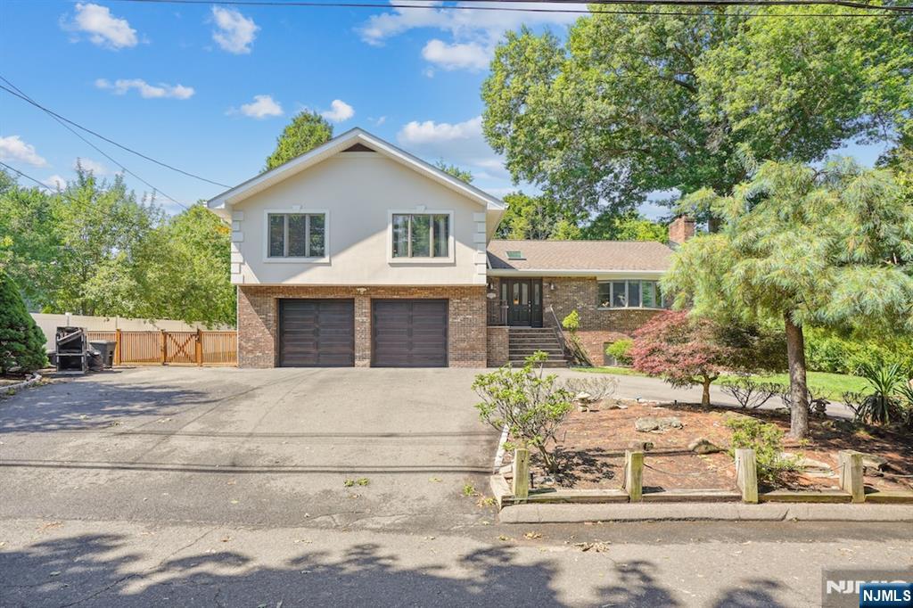 This 2,500 sq. ft. home offers 4 bedrooms and 3.5 bathrooms with a bright, functional layout. Enjoy an expansive living room, oversized family room, formal dining room, and a spacious eat-in kitchen with ample cabinetry and counter space. A partially finished basement provides flexible space for a recreation room, home office, gym, or storage. The private backyard is perfect for entertaining, featuring a beautiful in-ground pool, playground set, and generous outdoor space. A two-car garage and half-moon driveway provide ample parking. Ideally located just minutes from schools, parks, shopping, and dining, with NJ Transit within walking distance for an easy commute to New York City. Offered furnished or unfurnished, this exceptional home combines space, convenience, and flexibility in one of Bergen County's most desirable communities.
