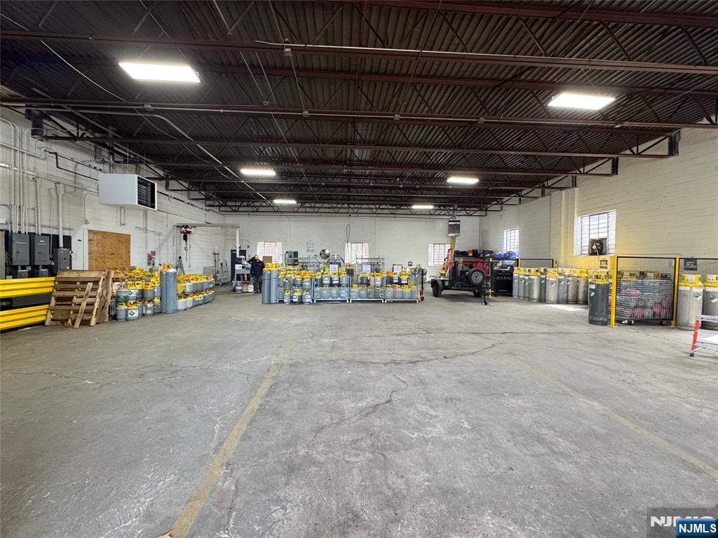 A free-standing industrial warehouse in the heart of Hackensack's established commercial district. The property offers a wide-open, clear-span high-bay production and storage floor with abundant overhead lighting, Over 6,000 SF warehouse+over 1,000 SF office space. Multiple restrooms, and dedicated on-site parking. Currently occupied by a tenant, Lease ends on 6/30/2027. It presents a versatile footprint for an owner-user or investor. Minutes from Routes 4, 17 and I-80