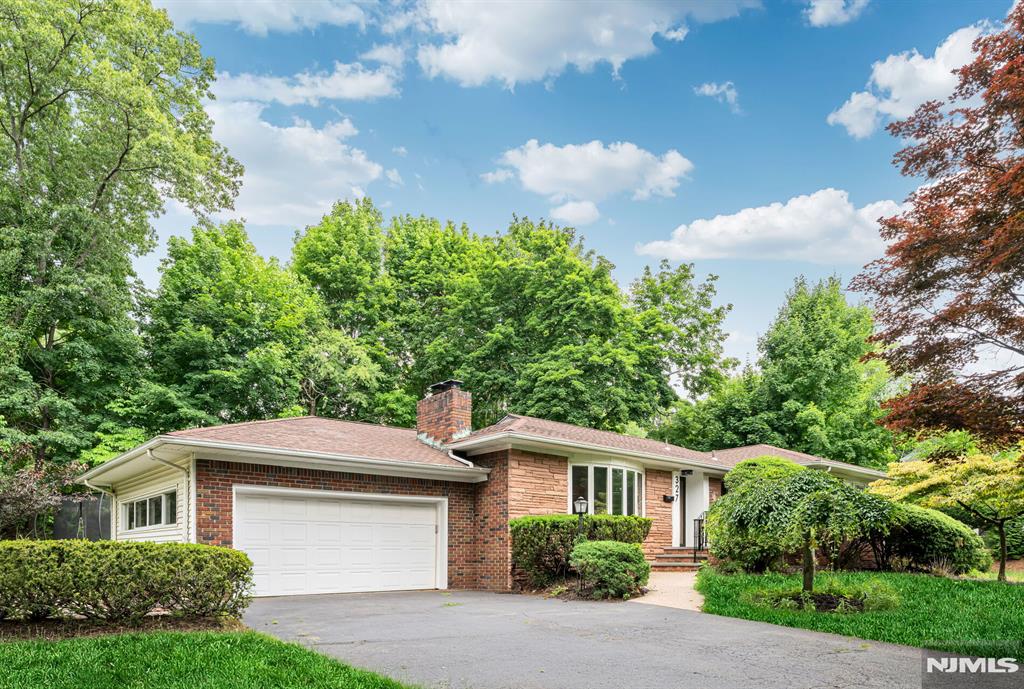 Tucked away at the end of a quiet cul-de-sac, this 3 bedroom, 3 bathroom ranch offers the perfect blend of privacy and convenience. Step inside to a welcoming living room with a cozy fireplace, which flows seamlessly into the dining area and a bright family room. Sliding doors open to a spacious deck and a private, tree lined backyard featuring a fenced dog run. The main level also hosts a functional kitchen with stainless steel appliances, two secondary bedrooms, a hall bath, and a primary suite with its own private bathroom. Downstairs, the finished basement drastically expands your living space with a large recreation/TV area, laundry, utility rooms, and a flexible bonus space with a full bath that could easily serve as a fourth bedroom. Key updates include a newer roof (2024), water heater (2022), and furnace (2018). Complete with a 2-car garage, central air, and an ideal location walking distance to the elementary school and minutes from Route 208!