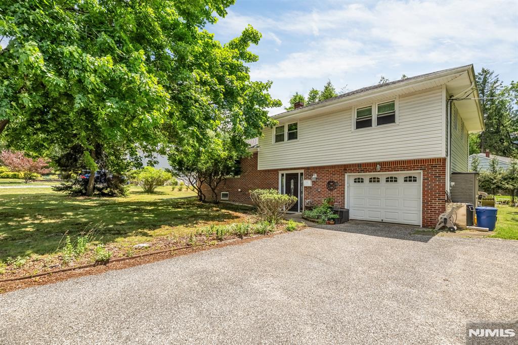 Beautiful Sugar Maple split-level home offering 3 bedrooms, 2.5 renovated bathrooms, and approximately 2,400 square feet of living space on all levels on a generous 0.36-acre property. Designed for both comfort and functionality, the home features a versatile bonus room that can easily serve as a home office, rec room, or home gym. The heart of the home is the beautifully renovated kitchen, completed in 2016, showcasing granite countertops, updated cabinetry, and newer appliances. Spacious living and dining areas provide an ideal setting for everyday living and entertaining. The fully finished basement offers valuable additional space, perfect for a family room, recreation area, gym, or media room. Major updates include a newer HVAC system installed in 2015, full-house central air conditioning, baseboard heating, and a newer roof, providing peace of mind for years to come. Outside, enjoy a private backyard retreat complete with a gazebo, swing set, picnic area, and storage shed. A 1-car attached garage and driveway parking for up to four additional vehicles complete this exceptional property. Conveniently located near schools, parks, shopping, and transportation, this move-in-ready home offers the perfect combination of space, updates, and outdoor enjoyment.
