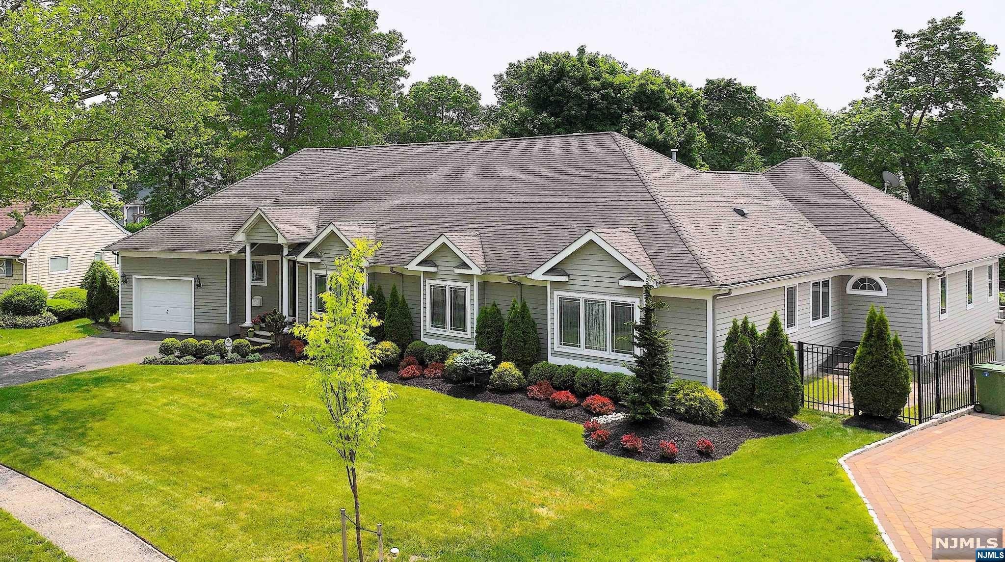 Amazing custom-built ranch home in sought after, prestigious Paramus. This home features one floor living, w/open concept fl. plan. Through the foyer, is a powder rm, laundry rm, and den/home office and then, you are warmly greeted into the main living area featuring a lg fam rm w/gas fpl w/cut stone surround, extra-lg dining rm, and the jewel of this home, a custom designed chef's gourmet kit complete w/center island, ss appl, sep prep area w/an addl. sink and bev ref & Brazilian quartzite countertops, w/hwd fls. An oversized wall of windows and 2 French doors leads out to the priv backyard sanctuary, w/an inground pool and lg tiered paver patio. The primary BR suite is king sized w/a sitting area, gas fpl, Brazilian cherry wood flooring, custom WIC, and primary full bath boasting Italian marble, a lg soaking, jetted tub and sep shower w/body sprays. Additionally, there is a jr suite w/priv bath, 2 addl brs & main bath. The full, exp. unfin bsmnt, is plumbed for an addl bath.