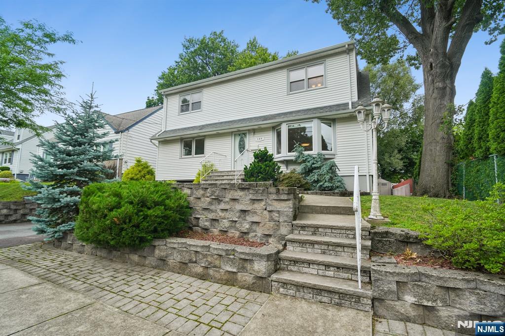 Nestled on a quiet, tree-lined street, this well-maintained Colonial blends timeless charm with everyday comfort. Offering 4 bedrooms, 2.5 baths, and a flexible layout, this home is designed to fit a variety of lifestyles. The sun-filled main level features a spacious living room, formal dining room, and a well-appointed kitchen that opens to a bright sunroom overlooking the backyard. A first-floor bedroom offers the perfect space for guests, a home office, or multigenerational living. Upstairs, you'll find three generously sized bedrooms with vaulted ceilings that create an open, airy feel. The finished lower level expands your living space with a comfortable den, home office, laundry area, and powder room. An attached one-car garage adds convenience. Outside, enjoy a spacious deck overlooking the above-ground pool, ideal for entertaining, relaxing, or making the most of warm summer days. Located in a peaceful neighborhood close to major transportation, schools, houses of worship, shopping, dining, and everyday conveniences, this warm and welcoming home is ready for its next chapter.