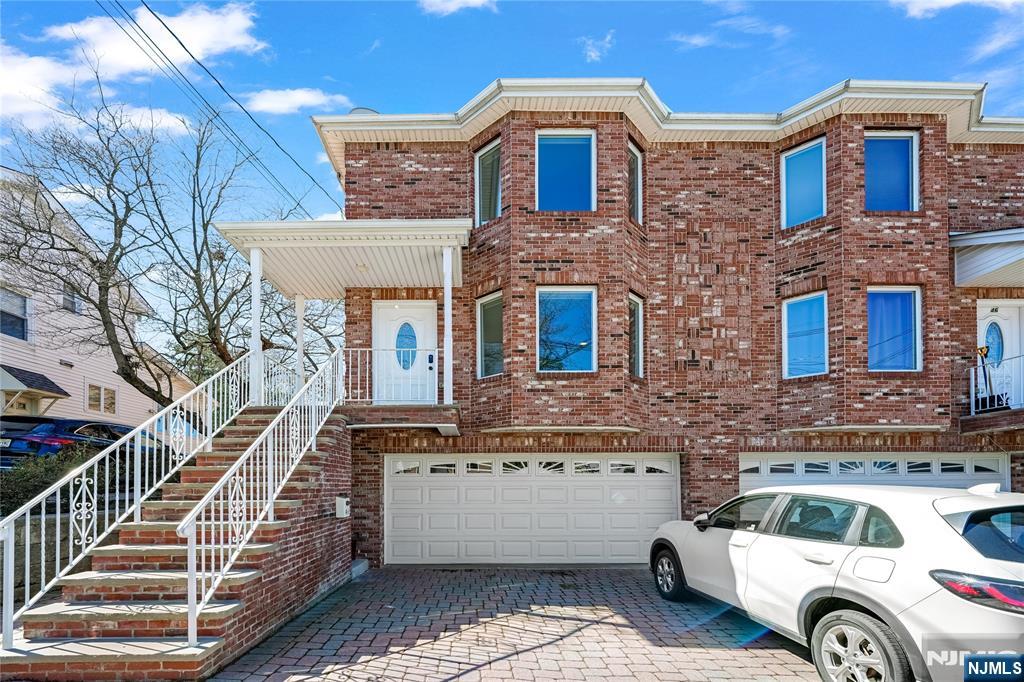 Spacious all-brick home situated on an oversized 50x125 lot. The first floor welcomes you with an extra-large living room and a convenient powder room. The open kitchen flows into a generous family room with access to the deck, perfect for entertaining. Upstairs offers four large bedrooms and two full bathrooms. The finished basement features a spacious family room, full bath, and private outside entrance. Additional highlights include central air and central vacuum. Excellent location close to NYC transportation, shopping, and all that this desirable town has to offer.