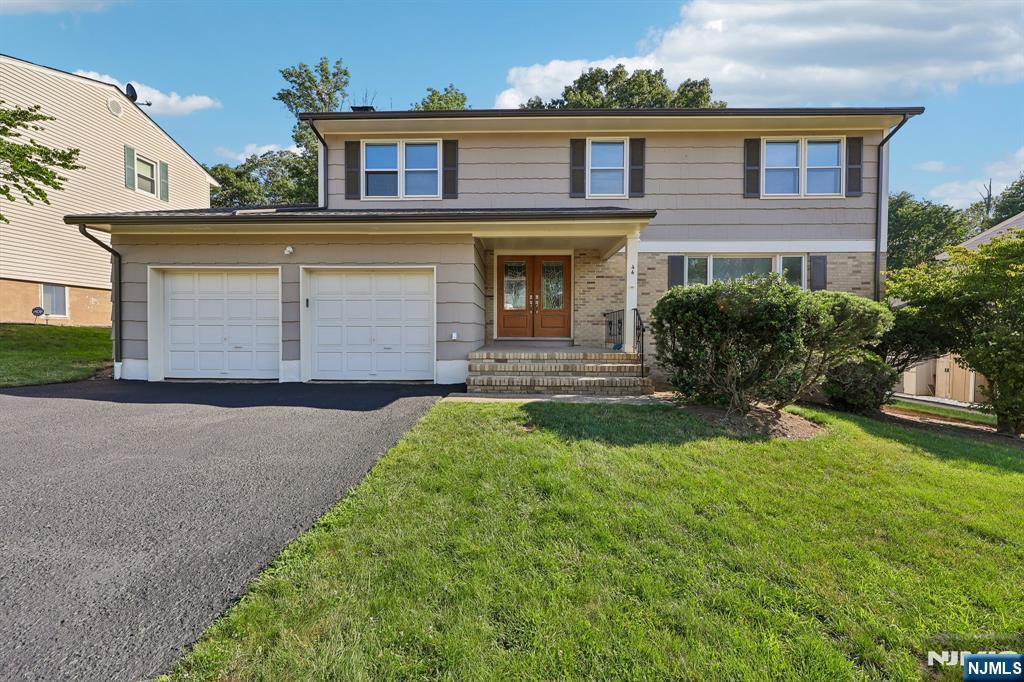 Welcome to this expansive Colonial nestled on a quiet dead-end street, offering the perfect combination of space, comfort, and functionality. This beautifully maintained home features a two-car attached garage and an impressive layout designed for both everyday living and entertaining. The second floor offers four generously sized bedrooms, a full hallway bath, and a spacious primary suite complete with a walk-in closet and private en-suite bathroom. The main level boasts a bright and inviting living room, formal dining room, large eat-in kitchen with a breakfast nook, convenient first-floor laundry room, full bathroom, and a cozy family room with a fireplace that opens directly onto a spacious deck overlooking the backyard. The fully finished basement is a standout feature with high ceilings, a full bathroom, abundant recreation space, and a separate storage room, providing endless possibilities for a home theater, gym, playroom, or guest area. Situated on a peaceful dead-end street, this exceptional home offers the space, layout, and location you've been searching for. Don't miss the opportunity to make this incredible Colonial your next home!