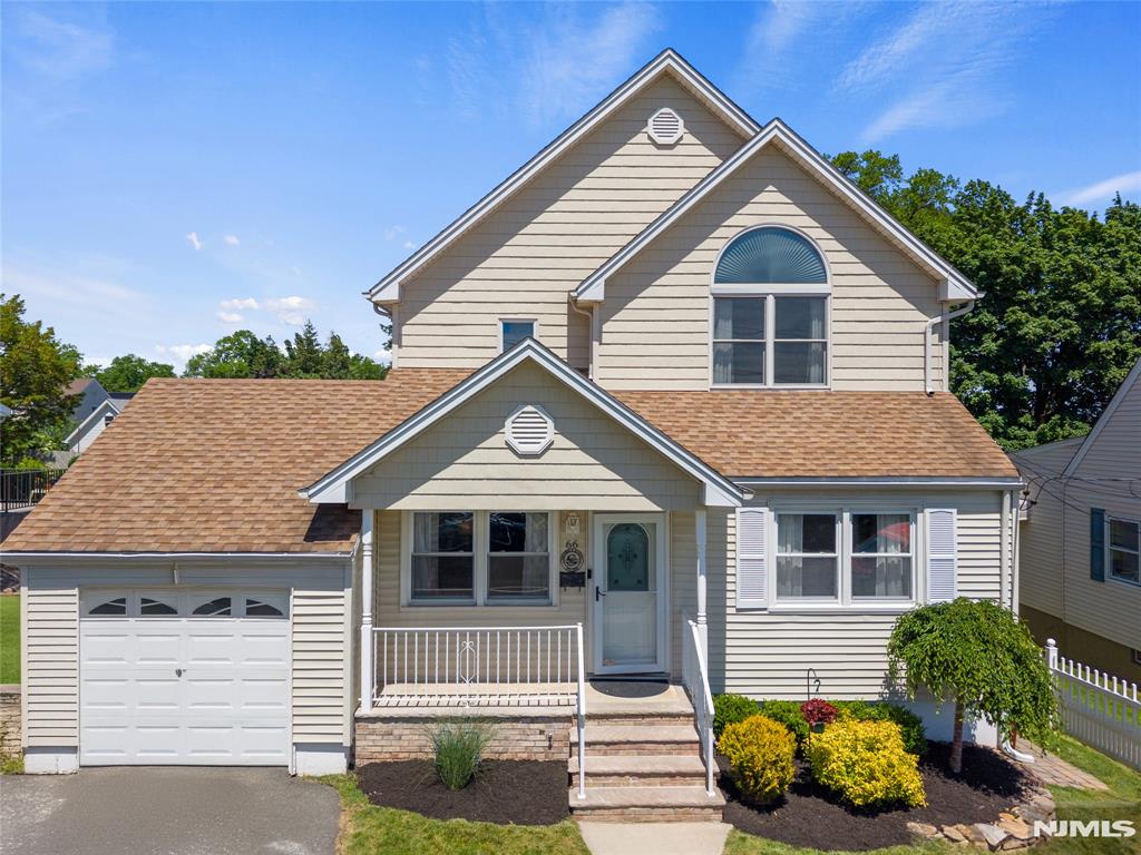 Located on a quiet residential street with views of the NYC skyline in the distance, this spacious home offers FOUR full levels of living space designed for today's lifestyle. The first floor features an inviting layout with a family room, living room, dining area, den, & kitchen nook that flow seamlessly for everyday living and entertaining. The kitchen overlooks the backyard and is complemented by an additional dining space. A full bath completes the main level. Upstairs, you'll find four bedrooms, a convenient laundry area, and an oversized main bath. The primary suite features soaring ceilings and a large walk in closet. A finished walk up attic provides additional flexible space ideal for a home office, recreation area, or guest retreat. The finished walk out basement offers a private entrance and expands the home's possibilities with a summer kitchen, living area, bonus room, and full bath, creating flexible space for guests, recreation, or work from home needs. Outside, enjoy a fully fenced backyard designed for entertaining, featuring a patio, above ground pool with swim up bar, and plenty of space for gatherings. Conveniently located near Radcliffe Elementary School, major highways, shopping, and NYC transportation, this move in ready home offers the space, flexibility, and lifestyle you've been searching for. Come see all that 66 Fischer Avenue has to offer.