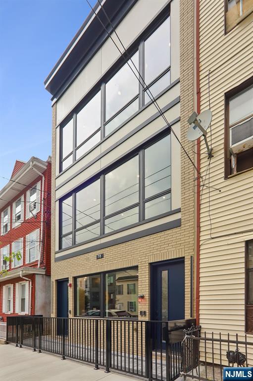 Welcome to Jersey City Heights and this exceptional newly constructed condominium, where contemporary luxury, refined design, and quality craftsmanship come together to create an extraordinary living experience. Perfectly situated in one of The Heightsâ€™ most desirable neighborhoods, this residence offers the ideal combination of style, and convenience. Upon entering, you are greeted by a bright and expansive open-concept floor plan highlighted by a designer kitchen featuring custom cabinetry, premium stainless-steel appliances, sleek quartz countertops, and a stunning waterfall island that serves as the centerpiece of the home. The living and dining areas provide an inviting space for both everyday living and entertaining, enhanced by a modern built-in electric fireplace that adds warmth and character. This thoughtfully designed home offers three spacious bedrooms and two beautifully appointed full bathrooms, including a luxurious primary suite designed as a private retreat. Light-toned flooring flows seamlessly throughout the residence, creating a warm and inviting atmosphere complemented by custom closets, central heating and cooling, and a dedicated laundry room for added convenience. Step outside to your exclusive backyard, meticulously designed to provide the perfect setting for outdoor entertaining, relaxation, and family gatherings. Ideally located just moments from NYC transportation, vibrant dining destinations, shopping, parks, and highly regarded schools.