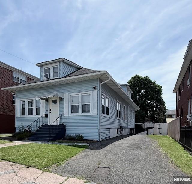 Welcome Home! This beautifully and meticulously maintained Cape-Cod updated 4-bedroom, 1-bath residence, renovated in 2015, is nestled on a quiet street in the highly desirable Lakeview section of Paterson. Combining modern updates with timeless charm, this home sits on a generous, fully fenced 50' x 150' level lot, offering privacy, outdoor enjoyment, and plenty of space for entertaining. Step inside to find gleaming hardwood floors flowing throughout the main living areas. The spacious, bright, and airy eat-in kitchen serves as the heart of the home, featuring updated countertops, stainless steel appliances, abundant cabinetry, and ample workspaceâ€”perfect for cooking enthusiasts and everyday living. The dining area opens seamlessly to the kitchen, creating an ideal space for family gatherings and holiday celebrations. The home offers a versatile floor plan with four generously sized bedrooms, including a large primary bedroom, and a tastefully renovated full bathroom with modern finishes. Enjoy relaxing mornings on the inviting front porch or unwind on the rear porch overlooking the expansive backyard. Whether you're enjoying your morning coffee or hosting summer BBQs, the outdoor space is sure to impress. Additional features include a full unfinished walk-out basement offering endless possibilities for storage or future expansion, a driveway that accommodates up to four vehicles, additional street parking, and low property taxes. Don't miss this incredible opportunity