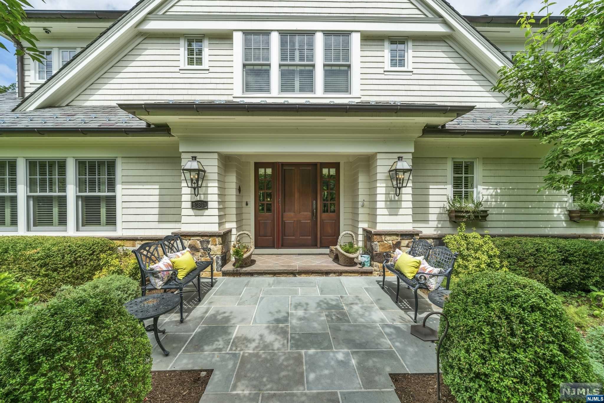 This elegant custom colonial has all of the luxurious details that today's discerning home buyer expects, including an in-ground gunite heated salt water pool/spa, an elevator to all floors and a whole house Generac generator. This home is on .54 acres in the desirable Hartshorn section of Short Hills with 5 bedrooms, 5 full baths and 3 half baths. The exterior is Hardie Plank, the roof is slate and there are copper gutters. Enter the expansive foyer and be captivated by the custom millwork, wide plank wood flooring and light filled living space. Adjacent to the foyer is the large formal dining room w/custom crown molding & wainscoting. The gourmet chef's kitchen has professional appliances, a center island with seating, a pantry closet and separate casual eating area that is open to the living room with a gas fireplace. This home boasts first and second floor primary suites. Both primary en-suite bathrooms have radiant floor heating. A sitting room/office with a deck, a mu