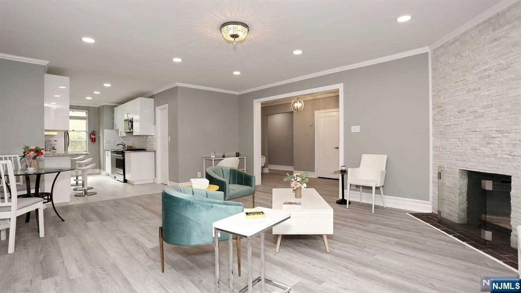 1230 sqft of luxury NYC living in the best building of East Hill area of Englewood - Dwight Manor, located in the picturesque park with manicured lawns! 10 min drive to NYC for a fraction of NYC cost of an upscale condo! NYC, local buses out front. Large as a house, stunning sun drenched 4th floor fully renovated largest on the market 2-bedroom condo in a secure historic building in the heart of Downtown Shopping & Restaurant District offers 9 ft ceilings, new state of art eat in kitchen with porcelain floors, stainless steel appliances, oversized breakfast bar, granite countertops, huge pantry, new bathroom, large bedrooms with a cedar closet, grand foyer, new gorgeous floors, natural stone wood burning fireplace, crown moldings, recess lighting, large windows, 7 big closets. Elevator. Parking space. Laundry. Gym. Cats OK! Next to the library, Bergen Performing Arts Center, yoga, hot yoga, Shoprite, Englewood Hospital, parks, Houses of Worship, & best restaurants! Relative has NJ