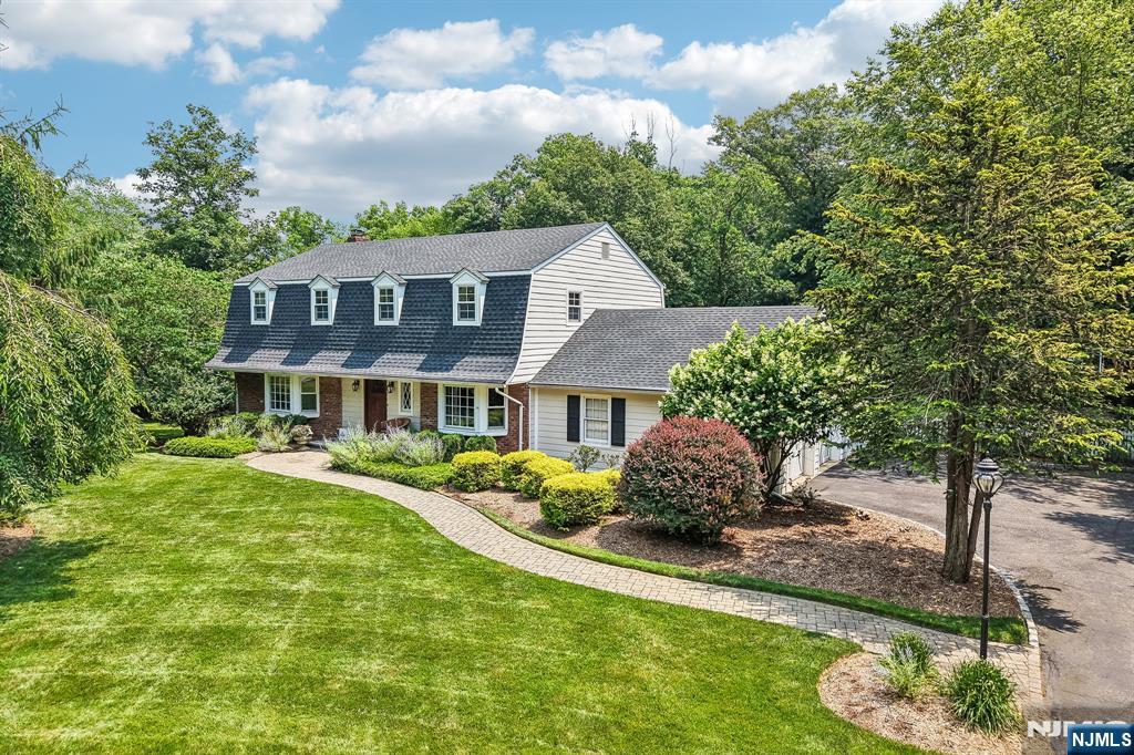 Wonderful opportunity in desirable Upper Saddle River! Cul de sac location with a beautiful 1.3 acre lot with mature landscaping and plantings, creating total privacy. Many updates throughout including new roof, hardwood floors, newer septic, new well pump, replacement windows throughout and updated kitchen and baths! Move right in and enjoy this center hall colonial with spacious rooms and a flexible first floor layout offering Living Room, Family Room, Dining Room & Eat-in kitchen. Light and bright spaces throughout, including the kitchen with french doors out to rear patio and yard. Upstairs four nicely sized bedrooms, with one offering a bonus loft space! Hardwood floors throughout the bedrooms. Primary suite with walk in closet and primary bath with dual vanities, soaking tub and oversized glass enclosed shower. Finished lower level recreation room offers terrific additional living space. A beautifully maintained home with parklike setting! Close proximity to schools & transportation! Don't wait on this one!
