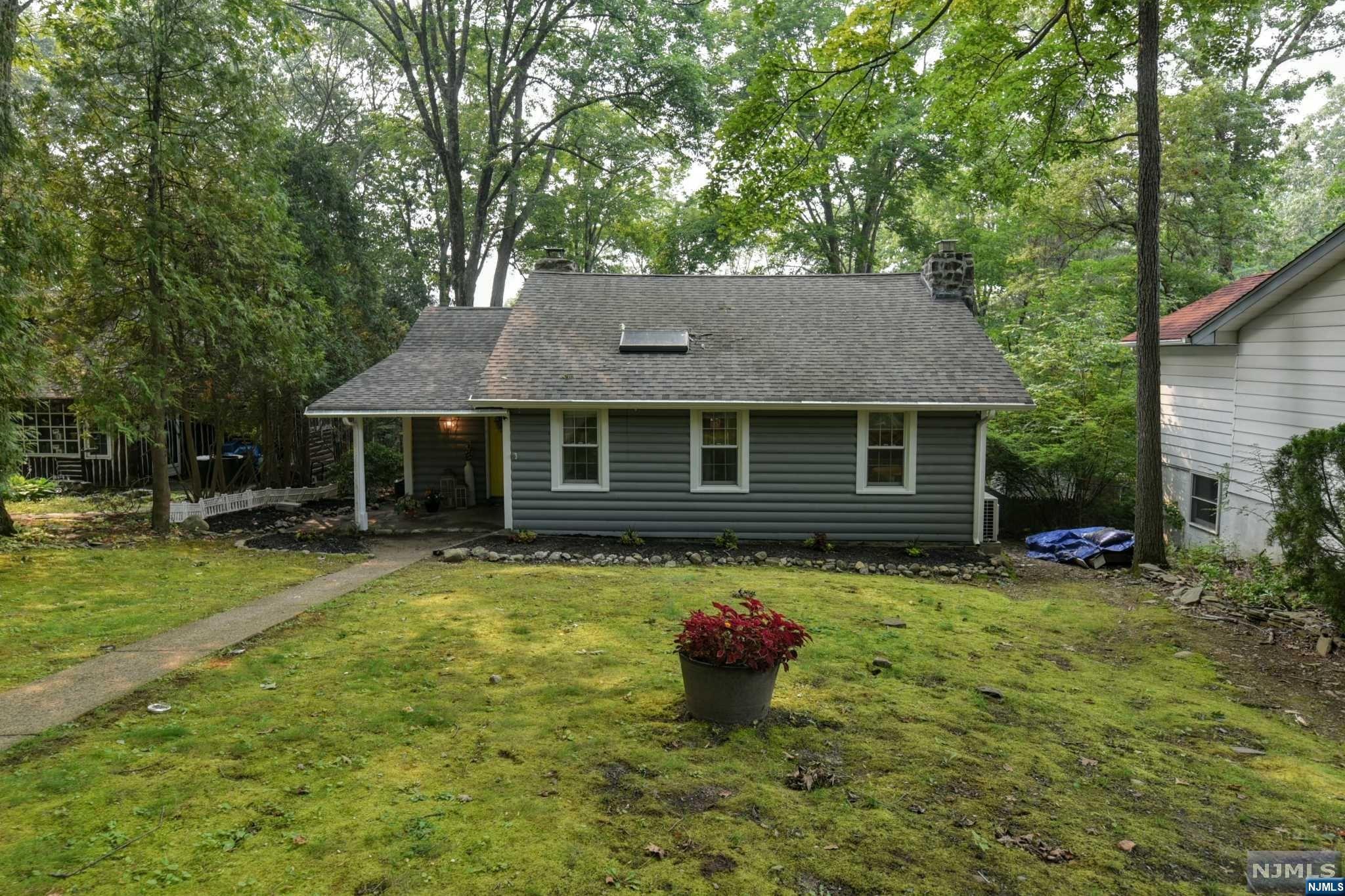 More than meets the eye in this Lake-style meets Upscale Cabin Design. This 3 BR, 2 BA Cupsaw Lake home with three season lake views is sure to please! Enter into the beautiful foyer. To the right is the living room full of rustic charm with built-ins and vaulted ceiling of cypress and chestnut log beams. Enjoy the updated kitchen with granite counters and s/s appliances. Lake views from the dining room to bring calm to your day. Outdoor living on your deck where you can soak it all in. 2 bedrooms and 1 bath complete this floor. Upstairs is the third bedroom. The finished walkout basement with full bath perfect for family room or home office. 0.1 miles and you are in Ringwood State Park with miles of trails to explore. Optional Cupsaw Lake membership.