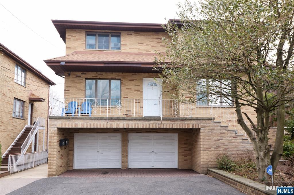 Welcome to this wonderful income-producing 2-family home on a spacious 50x100 lot in the heart of Fort Lee! This beautifully updated property offers a total of 8 bedrooms and 6 full bathrooms, making it perfect for both comfortable living and smart investing. You'll love the bright, sun-filled interiors thanks to the extra-large Anderson windows and freshly finished hardwood floors throughout. Bathrooms on the first floor and basement, plus all modern comforts like two central air conditioning units, two gas boilers, two hot water heaters, and convenient laundry in each unit. The first floor features a huge living room, formal dining room, eat-in kitchen with access to the rear deck, 3 bedrooms, and 2 full baths. Upstairs on the second floor, you'll find a matching layout with its own living room, dining room, eat-in kitchen, 3 bedrooms, and 2 full baths. The ground level adds even more space with an additional living room, dining room, 2 bedrooms, 2 baths, and a handy summer kitchen. Downstairs, the oversized walk-out heated basement is a versatile bonusâ€”ideal for storage, a workshop, exercise room, or whatever you can dream up. Step outside to enjoy the comfortable backyard, perfect for summer barbecues with family and friends. With a 2-car garage and all appliances and light fixtures included, this home is move-in ready and located in an excellent Fort Lee neighborhood. Itâ€™s primarily a high-density residential zone (R10) geared toward larger multifamily.