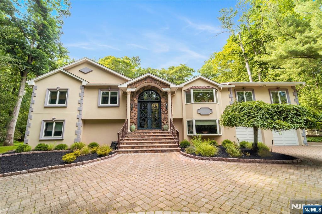 Beautifully updated custom home built in 2007 offering over 5,700 sq ft of living space in one of Old Tappanâ€™s most desirable neighborhoods. Featuring 4 bedrooms, 3 full and 1 half baths, low taxes, soaring two-story entry foyer, 3 fireplaces, spacious family and game rooms, and a stunning new kitchen with large center island and French doors leading to an oversized deck. The finished lower level includes a junior suite, recreation room, gym, sauna, wine cellar, home office, and additional family room space. Private backyard with swimming pool creates the perfect setting for summer fun, relaxation, and entertaining. Located near top-rated Blue Ribbon schools, parks, shopping, dining, and convenient NYC transportation. A rare opportunity to enjoy luxury living in the heart of Northern Valley.
