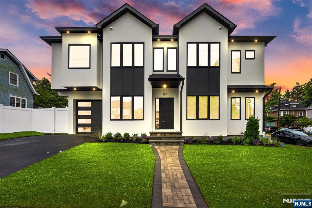 Thoughtfully designed new construction set on a private fenced 50 x 100 lot. Featuring 4 bedrooms and 4.5 bathrooms, this home offers spacious, light-filled interiors with elevated finishes throughout. The expansive primary suite is highlighted by an impressive walk-up closet with custom built-ins, creating a space that feels both functional and indulgent. A fully finished basement with a summer kitchen adds valuable flexibility for entertaining, extended living, or guest accommodations. Complete with a 1-car attached garage and private outdoor yard, this home delivers comfort, style, and versatility in every detail.