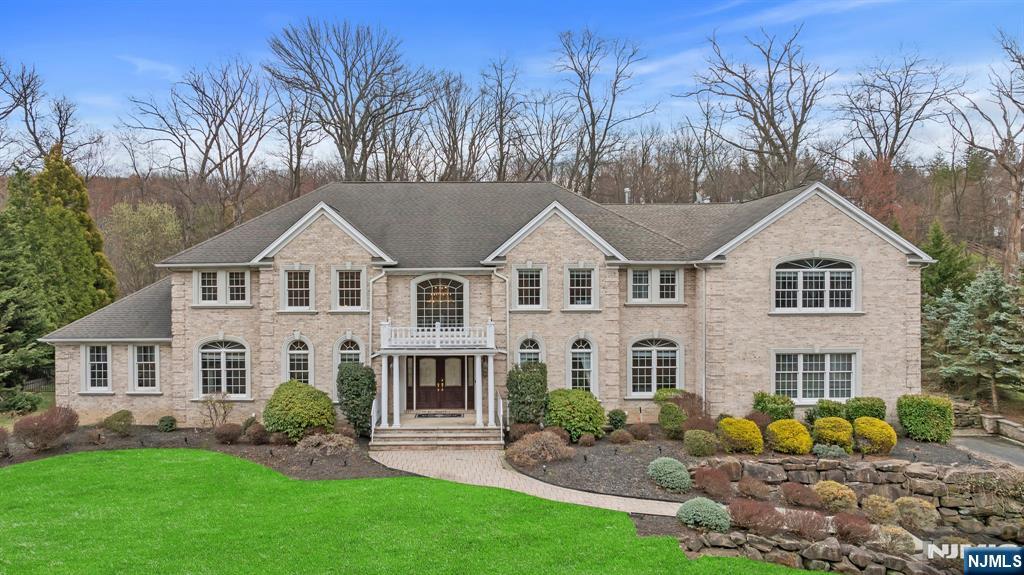 Step into sophistication in this 5,400+ sq. ft. estate where timeless elegance meets modern comfort. A grand 2-story marble foyer sets the stage. To the left, a soaring formal living room and office w/gas fireplace create a warm welcome. To the right, the formal dining room is perfect for elegant gatherings. The chefâ€™s kitchen boasts Sub-Zero fridge, double ovens, gas cooktop w/warming drawer, 2 dishwashers, and a beverage center w/sink. An expansive great room w/double-sided gas fireplace flows into a conservatory w/French doors, tray ceiling, and patio access. A family room over the garage is plumbed for a wet bar. The first floor also includes a bedroom, full bath, powder room, laundry, and Brazilian hardwood floors. Upstairs, the primary suite features a private office, fireplace, walk-in closet, and new marble spa bath w/dual sinks, soaking tub, and large shower. Three more en-suites and a 2nd laundry room complete the home. A stunning blend of luxury and livability!