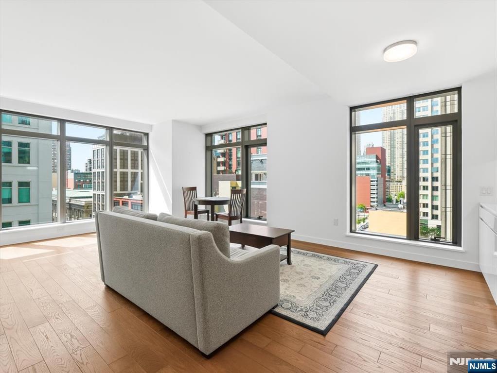 Welcome to Residence at 99 Hudson Street, a premier luxury tower in the heart of Downtown Jersey City. This thoughtfully designed 640 sq.ft. studio condo offers an exceptional blend of modern style, comfort, and functionality.The open-concept layout maximizes space and natural light with expansive floor-to-ceiling windows, high ceilings, and wide-plank hardwood floors throughout. The flexible living area easily accommodates both everyday living and a dedicated work-from-home setup.The contemporary kitchen features premium stainless steel appliances, custom cabinetry, and sleek quartz countertops, ideal for cooking and entertaining. The full bathroom is finished with spa-inspired details, elegant tilework, and modern fixtures.Residents enjoy access to an impressive collection of resort-style amenities, including a state-of-the-art fitness center, swimming pool, resident lounges, childrenâ€™s playroom, landscaped outdoor spaces, and 24-hour concierge service.Perfectly positioned in Downtown Jersey City, the building offers convenient access to the waterfront, restaurants, shopping, nightlife, PATH trains, ferries, and major transportation options.A rare opportunity to own a stylish residence in one of Jersey Cityâ€™s most sought-after luxury buildings.
