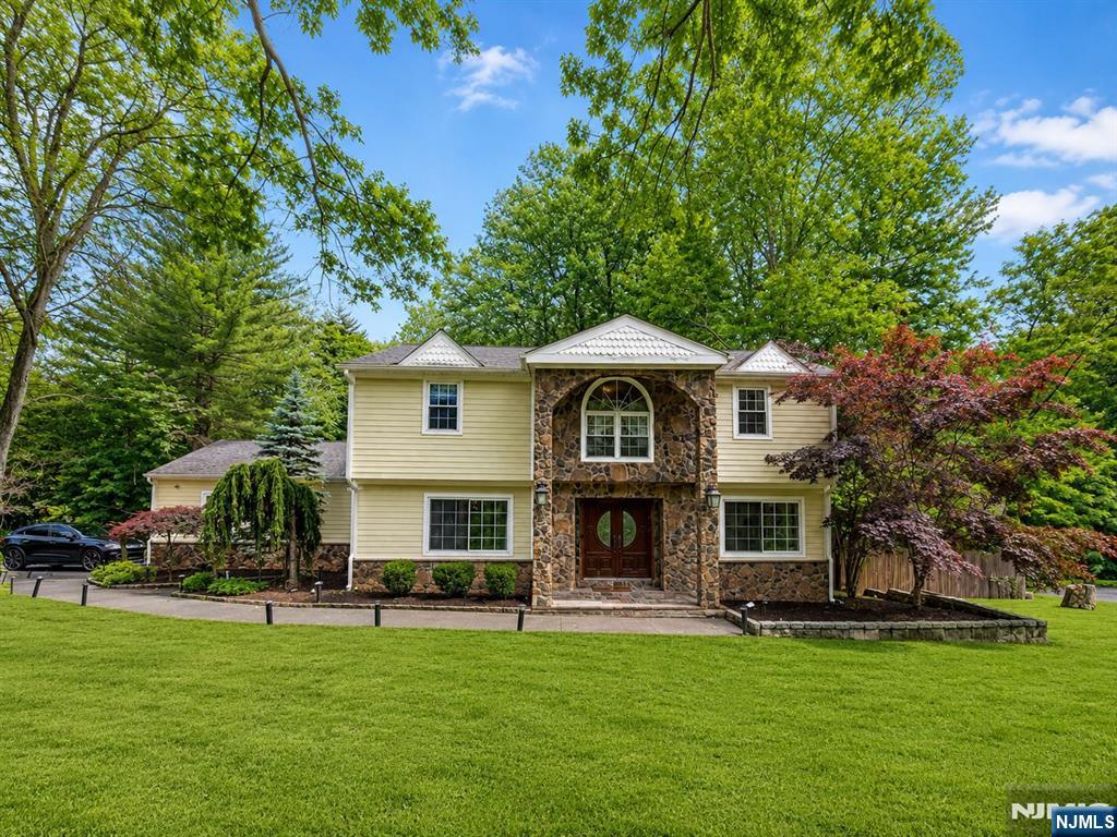Set on Norwoodâ€™s desirable East Hill, this spacious home sits on a beautiful one-acre property bordering hundreds of acres of Palisades hiking trails, all just minutes from the George Washington Bridge. The main level features an oversized kitchen with cherry cabinetry, granite countertops, stainless steel appliances, two dishwashers, and a breakfast nook overlooking the backyard. The kitchen opens to a large family room with vaulted ceilings, a fireplace, and three sets of French doors leading to the deck and private yard. A formal dining room, office/den, and powder room complete the first floor. Upstairs offers a primary suite, four additional bedrooms, and a full bath. The walkout lower level includes two bedrooms, a full bath, laundry area, and a family room with direct access to the fenced backyard and in-ground pool. Offering a flexible floor plan, generous living space, and an exceptional location, this home presents a wonderful opportunity to personalize and make it your own in one of Norwoodâ€™s most sought-after neighborhoods. Contact agent Nicole Levy 201-774-4004 Or Rotem Lindenberg 646-321-0186