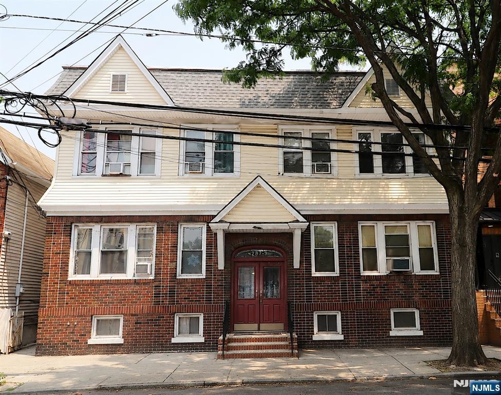 GREAT INVESTMENT OPPORTUNITY! Welcome to this well-maintained, four-family, two-story property located in the highly desirable Ironbound section of Newark. Situated on an oversized 50' x 100' lot, this income-producing property is just steps from the Ironbound's renowned restaurants, shopping, entertainment, and public transportation. The building features four spacious apartments with two- and three-bedroom layouts, each with a modern kitchen, living room, dining area, full bath, and beautiful hardwood floors throughout. Additional highlights include a partially finished basement with a laundry area, separate utilities, a brick-front exterior with aluminum siding, and two detached garages in the rear, providing valuable storage. Whether you're an investor seeking strong cash flow or an owner-occupant looking to offset your mortgage with rental income, this versatile property offers exceptional value in one of Newark's most vibrant and sought-after neighborhoods. Don't miss this rare opportunity to own a well-maintained, income-producing property in the heart of the Ironbound!