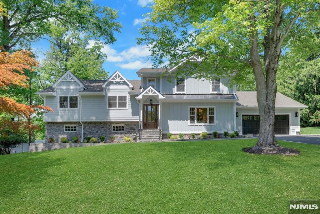 Experience elevated living in this custom-built 5 BR, 3 F& 2 half bath luxury residence, showcasing refined design & craftsmanship. Perfectly positioned on a fab street this home blends timeless architecture with a modern, sophisticated aesthetic. The entire upper level is dedicated to a private primary suite, a serene retreat complete with spa-like bath: freestanding soaking tub, glass-enclosed shower, dual vanities, & walk-in dressing areas. Main level boasts a bright, open-concept floor plan ideal for entertaining, a chefâ€™s kitchen equipped with top-tier appliances, quartz counters, custom cabinets, & an oversized island that flows seamlessly into the FR w/gas fireplace & sliders to the yard. A formal DR, butlerâ€™s pantry, & flex space for an office/den provide versatility & elegance. Walk-out lower level adds another dimension of living spaceâ€”perfect for a home gym, media room, or guest suite & includes a PR & access to the outdoors a serene, wooded backyard, offering the ultimate private setting for gatherings or quiet relaxation. The outdoor space is ideal for a future pool, patio, or entertaining areaâ€”creating your own personal oasis surrounded by nature. White oak floors, custom millwork, designer lighting, & expansive windows that fill each room with natural light. Every detail reflects thoughtful design & high-end finishes. Located just 20 mi to NYC, parks, restaurants, & major roads nearby, this home offers the perfect balance of luxury, lifestyle, & locatio