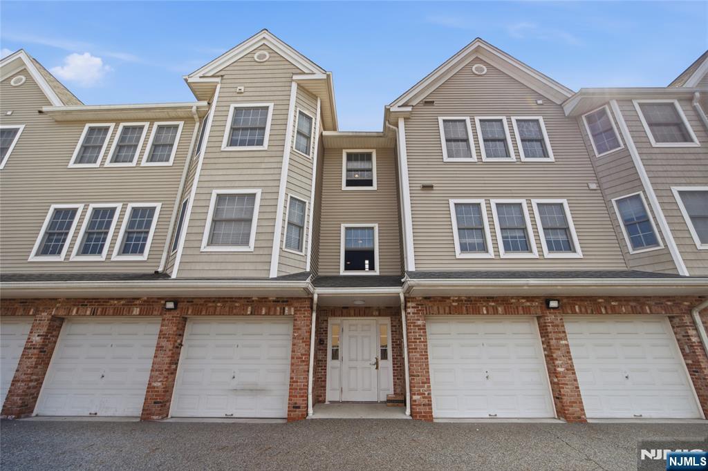 A rare opportunity awaits in the heart of Palisades Park! Unit 4C at 270 Grand Avenue is a beautifully appointed, sun-filled 2 bedroom and 2-bathroom condominium offering an exceptional blend of modern elegance and premier convenience. Highlighting this highly desirable home is its rare parking for TWO vehicles, featuring a private 1-car garage plus an additional dedicated outdoor parking space! Step inside to discover rich hardwood floors flowing seamlessly throughout the bright, open living and dining spaces. The thoughtfully designed kitchen is a chef's delight, complete with granite countertops, a center island perfect for casual dining, classic maple cabinetry, a refined stone tile backsplash, and high-quality stainless steel appliances. The spacious primary suite is bathed in natural light, offering a tranquil, verdant outlook and a private en-suite bath. The second bedroom is equally generous, serving perfectly as a guest suite or a dedicated home office. Both full bathrooms are tastefully appointed with clean, classic finishes and elegant stone tiling. Located in Bergen Countyâ€™s most connected community, this address places you moments from the exceptional dining, shopping, and cafes along Broad Avenue. Commuters will love the effortless access to the George Washington Bridge, Route 1&9, and NYC bus lines, making your journey into Manhattan swift and seamless.