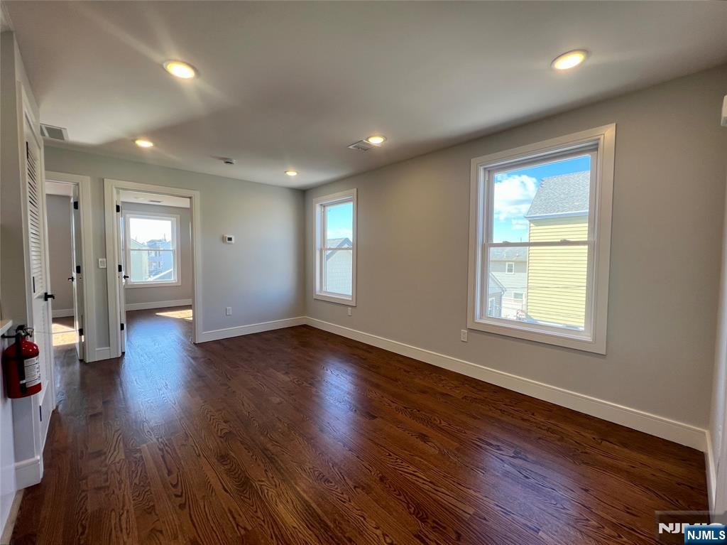 Immaculate 3-bedroom, 2-bathroom unit offering modern finishes and ample living space on the 2nd floor of this well maintained property. Everything in this home has been completely renovated! Enjoy cooking in the modern kitchen featuring stainless steel appliances, quartz countertops, and sleek fixtures. The open-concept living area is illuminated by recessed lighting, windows flooding in natural light and hardwood floors that flow seamlessly throughout. A highlight of this space is the huge master bedroom with ensuite providing plenty of room for comfort and privacy. The two additional bedrooms are generously sized and equal in dimension, perfect for family, guests, or a home office. Additional features include a full-size washer and dryer, shared backyard space perfect for relaxing or entertaining and two car parking. All of this located minutes from bus transportation, a large park just a few blocks away and all shops and restaurants the area has to offer.