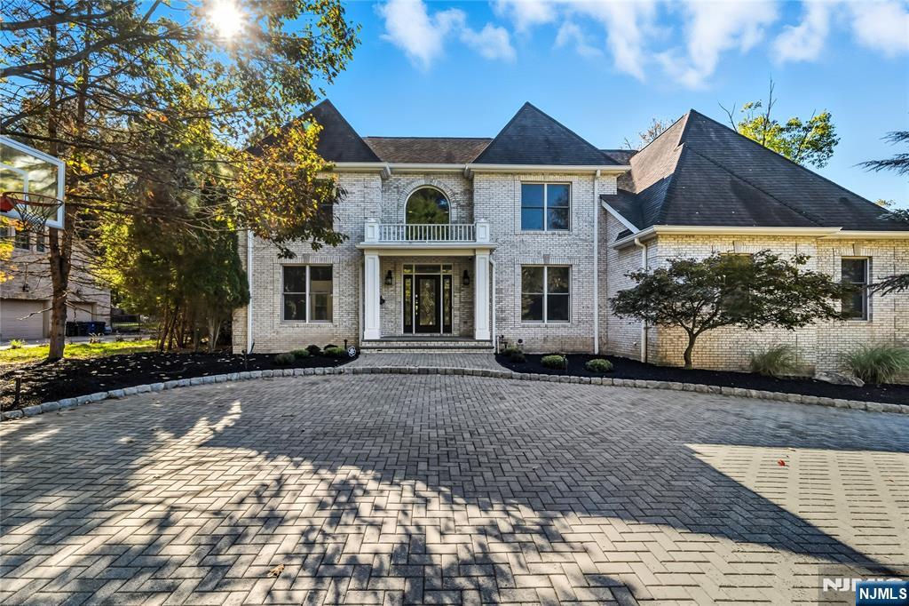 Welcome to 32 Moeser Place, a beautifully renovated home in the desirable community of Old Tappan, New Jersey, located within the townâ€™s highly sought-after Blue Ribbon school district. This charming residence blends classic appeal with modern updates, offering comfort, style, and functionality throughout. Step inside to find a freshly painted interior that creates a bright and inviting atmosphere. The main living areas feature refinished and beautifully stained hardwood floors, adding warmth and elegance to every room. The updated kitchen is the heart of the home, showcasing sleek countertops, modern cabinetry, and stainless steel appliancesâ€”perfect for everyday living and entertaining. Thoughtful renovations extend throughout, giving the entire home a fresh, move-in-ready feel. Natural light floods the living spaces, enhancing the home's airy ambiance. The flexible layout provides plenty of room for both relaxation and gatherings. Enjoy a cinematic experience in your private, high-end Dolby Atmos 4K theater featuring tiered seating for 10â€”fully included. Outside, enjoy a spacious yard ideal for outdoor living, gardening, or play. Located on a quiet street in a sought-after neighborhood, this property offers the perfect combination of privacy and convenience, with nearby parks, schools, shops, and dining.
