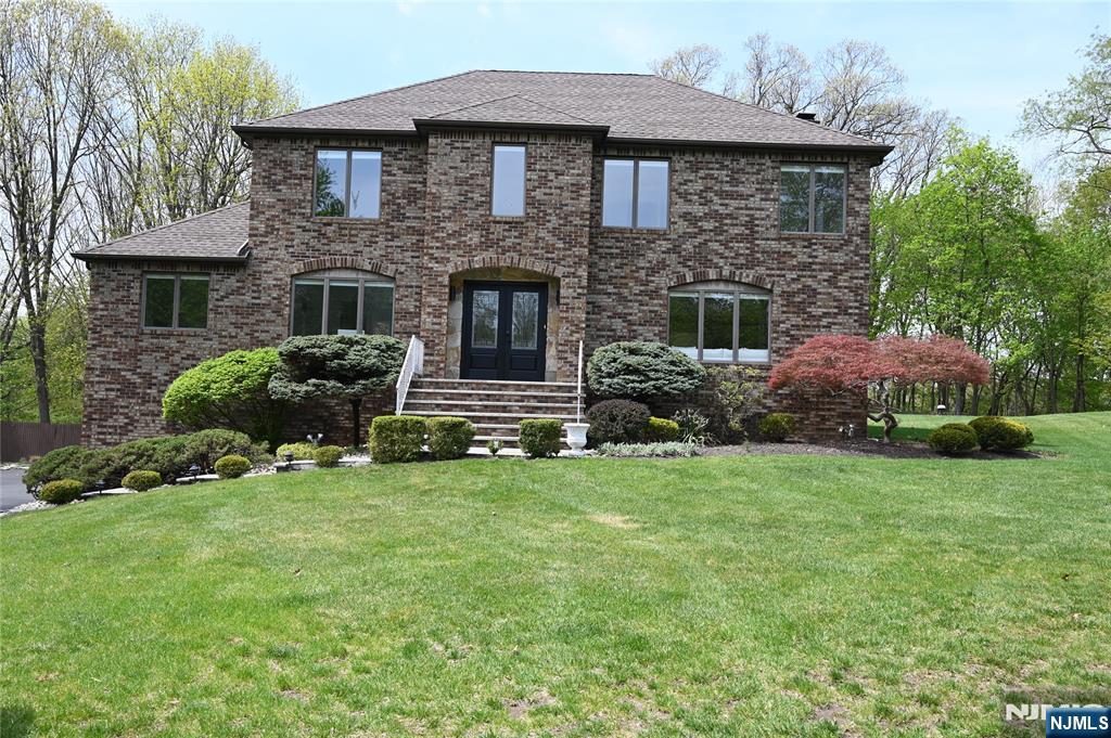 Beautifully renovated brick Colonial set on a private 3/4 acre lot in a quiet double cul-de-sac. This move-in ready home features 4 bedrooms and 3.5 updated baths with all new cabinetry. The fully renovated interior includes a brand-new kitchen, updated flooring throughout, and all new lighting fixtures. The functional layout is ideal for both everyday living and entertaining. A fully finished basement provides additional versatile living space perfect for a recreation room, home office, or gym. Surrounded by mature landscaping, the property offers exceptional privacy while remaining conveniently located near local amenities, schools, and major routes. PERFECT Turnkey condition just unpack and enjoy!