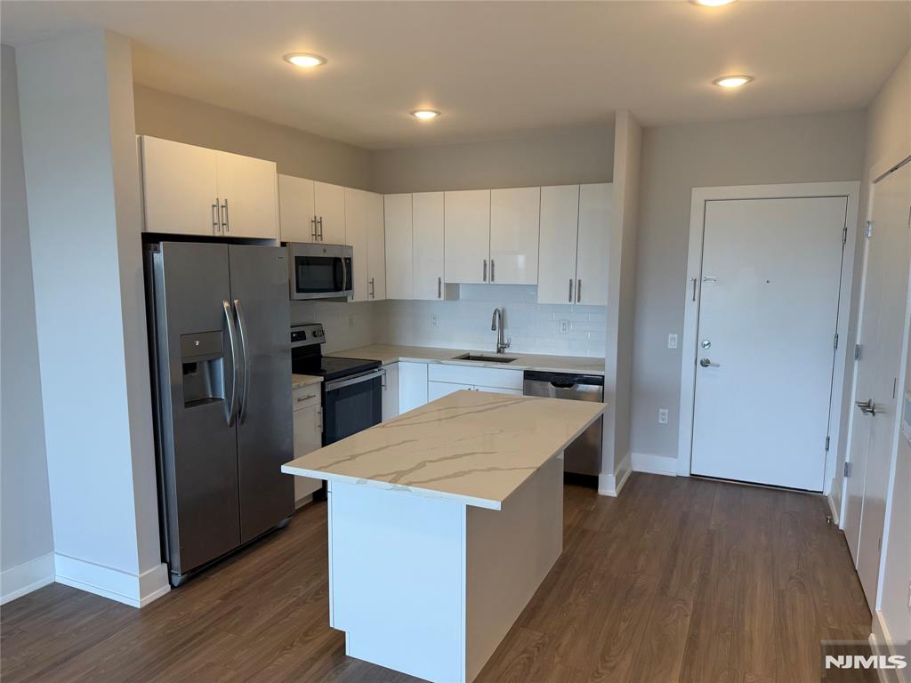 **FIRST MONTH FREE on a 13-month lease + one parking space included! - for occupancy commencing on or before 7/1/26!** Welcome to The Addison - Fort Lee's new luxury rental building offering a variety of upscale, spacious floor-plans. The Addison offers high-end residences fully equipped w/ modern kitchens w/ stainless steel appliances, quartz countertops, full islands & tiled backsplashes, open living/dining areas, shades on all windows, modern bathrooms & a full-sized washer & dryer in each unit. Exclusive 24/7 virtual doorman service for communications, package deliveries & access control via video intercom system linked to your smart phone. The Addison includes a large on-site fitness center including virtual touchscreen workout mirror, electric car charging stations & parking garage w/ direct elevator access to all residences for uncompromising security. Pet friendly - (25 lb limit) $500 pet fee + pet rent per month! Tenants pay ALL utilities! All amenities INCLUDED in the rent! PARKING: 1st space INCLUDED IN THE RENT(!); Additional space - $125/monthly! Virtual tour available upon request!