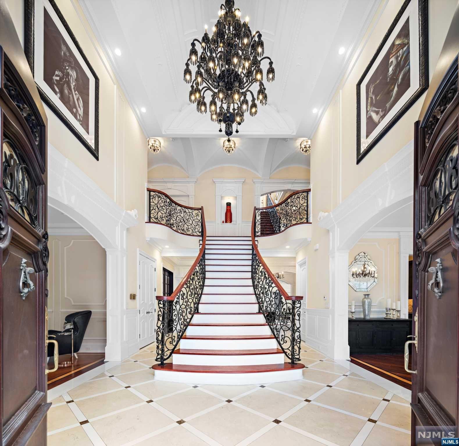 CUSTOM BUILT COLONIAL 6 YRS YOUNG WITH EXCEPTIONAL ATTENTION TO QUALITY, DESIGN & DETAIL OFFERING 8,000 SQ. FT OF LIVING SPACE, 5 BEDROOMS AND 5.5 BATHS LOCATED IN THE PRESTIGIOUS BLUFF SECTION OF FORT LEE. RESIDENCE OFFERS 10' CEILINGS W/ARCHITECTURAL MOLDINGS, GRAND FOYER STAIRCASE, CUSTOM GOURMET KITCHEN W/ WOLF AND SUBZERO APPLIANCE PACKAGE, EXPANSIVE WINDOWS OVERLOOKING THE PATIO & PRIVATE GARDEN. SPECTACULAR MASTER SUITE COMPLETE WITH CUSTOM WALK-IN CLOSETS, FIREPLACE & LUXURIOUS MASTER BATH W/STEAM, HIS & HER SHOWER, DOUBLE VANITY, FREE STANDING TUB, RADIANT FLOOR HEAT THROUGHOUT AND WALK OUT TERRACES BOASTING NYC VIEWS. LOWER LEVEL FEATURES REC ROOM, SPA W/ SAUNA, GYM, AND HOME THEATER. CIRCULAR DRIVEWAY WITH AUTOMATED GATE, 3 CAR GARAGE, SEC CAMERAS, OUTDOOR KITCHEN, COVERED ENTERTAINMENT AREA /W COMM AND CEILING FAN AND MULTIPLE OUTDOOR TERRACES WITH PANORAMIC VIEWS OF NYC SKYLINE & HUDSON RIVERVIEWS!!!