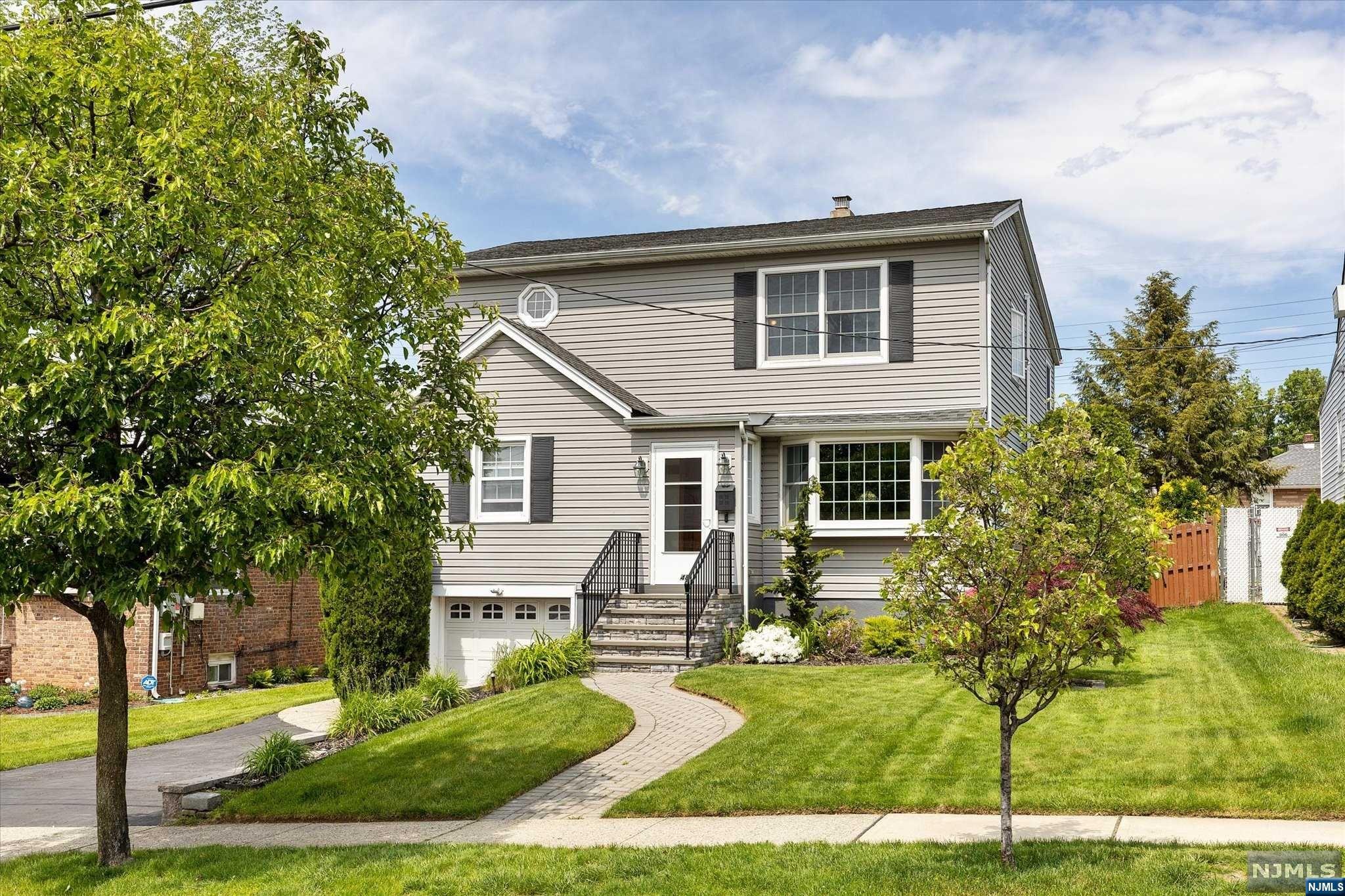 LOVINGLY MAINTAINED CUSTOM EXPANDED 09' HOME POSITIONED IN DISIRABLE RESIDENTIAL LOCATION FEATURES A UNIQUE BLUEPRINT OF ABRUPTING A REAR STREET (BALTIMORE)PROVIDING ADDITIONAL CONVENIENT REAR ACCESS TO THIS PROPERTY OF MATURE GARDENS, PATIO AND TO THE HOME. TRULY AN OUTDOOR OASIS READY FOR NEW OWNERS TO ENJOY! FEATURES INCLUDE CENTRAL AIR 5yr, GAS BASEBOARD 3 ZONE HEAT 3yr, HOT WATER 7yr, ROOF 14yr, LAWN SPRINKLERS & KEYPAD GARAGE ENTRY MAKES THIS 4 BEDROOMS, 3 FULL BATHS PLUS FAMILY ROOM WITH FIREPLACE A GREAT CHOICE!