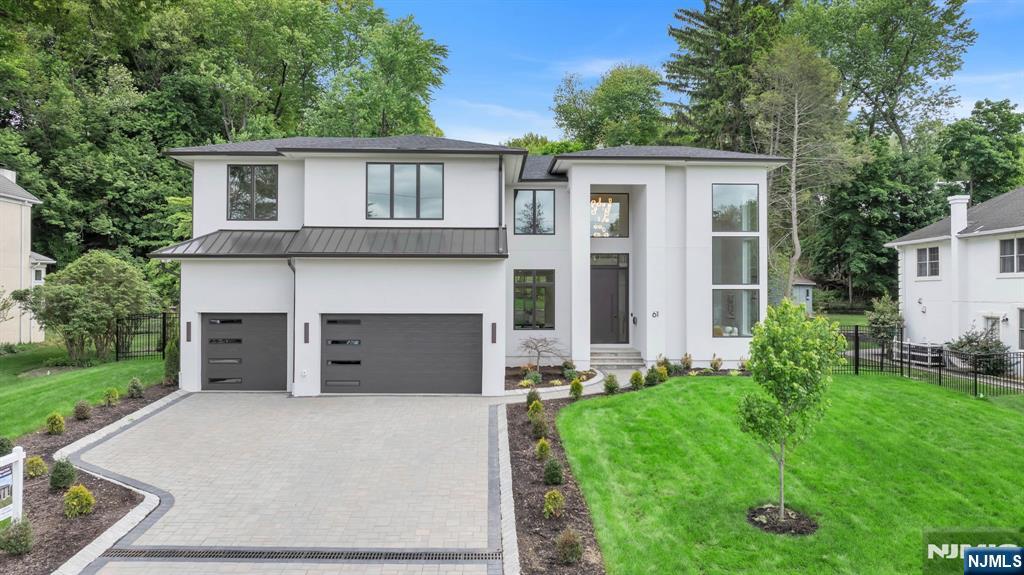 Experience exceptional luxury in this stunning new construction home on Closterâ€™s prestigious East Hill.Offering 6 bedrooms and 6.5 baths, this extraordinary home showcases impeccable design,custom craftsmanship, and elevated modern living throughout.A grand entry foyer welcomes you into a breathtaking interior with soaring 11, 17, and 22-foot ceilings, dramatic walls of glass, and abundant natural light.The spectacular living room features exceptionally high ceilings and oversized windows, while the formal dining room flows seamlessly into a state-of-the-art modern kitchen with custom cabinetry, high-end appliances, built-in wine fridge, premium finishes, and an open layout overlooking the expansive family room and private backyard.A first-floor junior suite, pantry,powder room, and mudroom complete the main level.Upstairs, the luxurious primary suite offers two oversized walk-in closets, coffee bar with beverage fridge,a spa-like bath with soaking tub, oversized shower, and dual vanities. Three additional junior suites and a spacious laundry room complete the second floor.The finished lower level includes an additional bedroom, full bath, recreation room, wet bar, and flexible space for a gym or theater. Additional highlights include radiant heat in the full baths, flush LED lighting, flush HVAC vents, full-house generator, custom millwork, 3 car garage,outdoor patio with cooking area, and a beautifully private expansive yard. A rare East Hill opportunity.NEW PHOTOS 5/16/