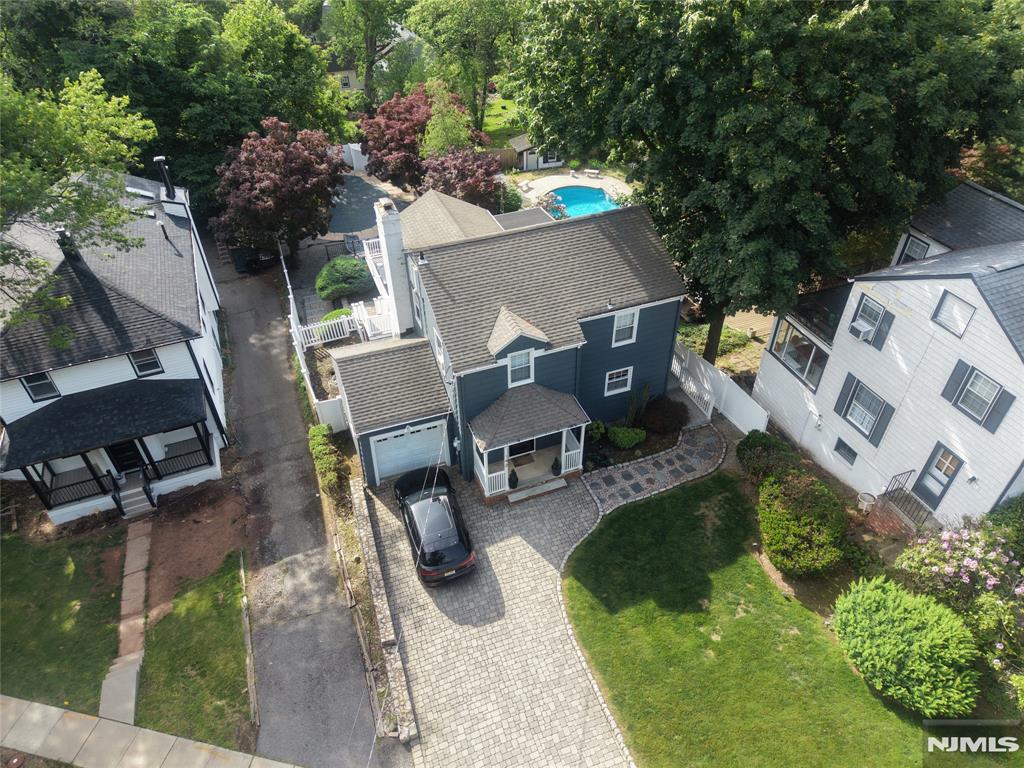 Welcome to 142 Walker Road, where thoughtful updates, versatile living spaces, and a backyard oasis combine to deliver the lifestyle today's buyers are searching for. From the moment you arrive, you'll immediately appreciate the pride of ownership and meticulous care invested in maintaining and enhancing this beautiful home. The open concept layout flows seamlessly into the kitchen, which features new stainless steel appliances. Designed for entertaining and everyday enjoyment, the outdoor space features multi-level decks, a patio, a heated in-ground pool, and a hot tubâ€”your own private oasis for summer gatherings and year-round relaxation. Seasonal skyline views add charm and beauty. The fully finished walkout basement/ground floor further expands the living space with a fourth bedroom, full bathroom, recreation area, and endless possibilities for guests, extended living, or entertainment. Conveniently located with a NYC jitney stop at the end of the street, this home offers the perfect balance of suburban tranquility and commuter convenience. Beautifully maintained, thoughtfully updated, and designed for both everyday living and exceptional entertaining.