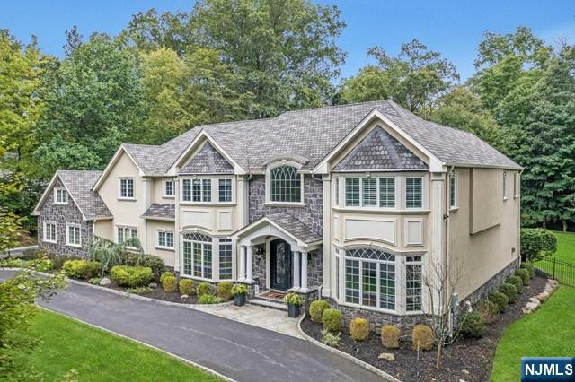 Experience luxury living in prestigious Anona Park, where this custom-built home offers an exceptional setting for entertaining & relaxation. A circular driveway leads to this stunning residence. The elegant two-story foyer opens to a gallery hallway & wrought-iron doors, unveiling a custom wine cellar. The chef's kitchen is a culinary dream with professional grade appliances, spacious quartz seated island & abundant cabinetry. The eat-in area overlooks a resort-like backyard with a saltwater pool, waterfall, outdoor kitchen & expansive patios perfect for gatherings. The pub room, ideal for hosting events & enjoying game days, opens to a covered patio with a fpl. 1st floor en-suite BR & study. Upstairs 4 en-suite BR's, including a primary suite with a boutique-style closet & spa-like bath. Lower level offers space for movie nights, fitness, & hobbies. Anona Park's private membership includes access to a lake, tennis courts, a playground & a pavilion for an exceptional lifestyle.