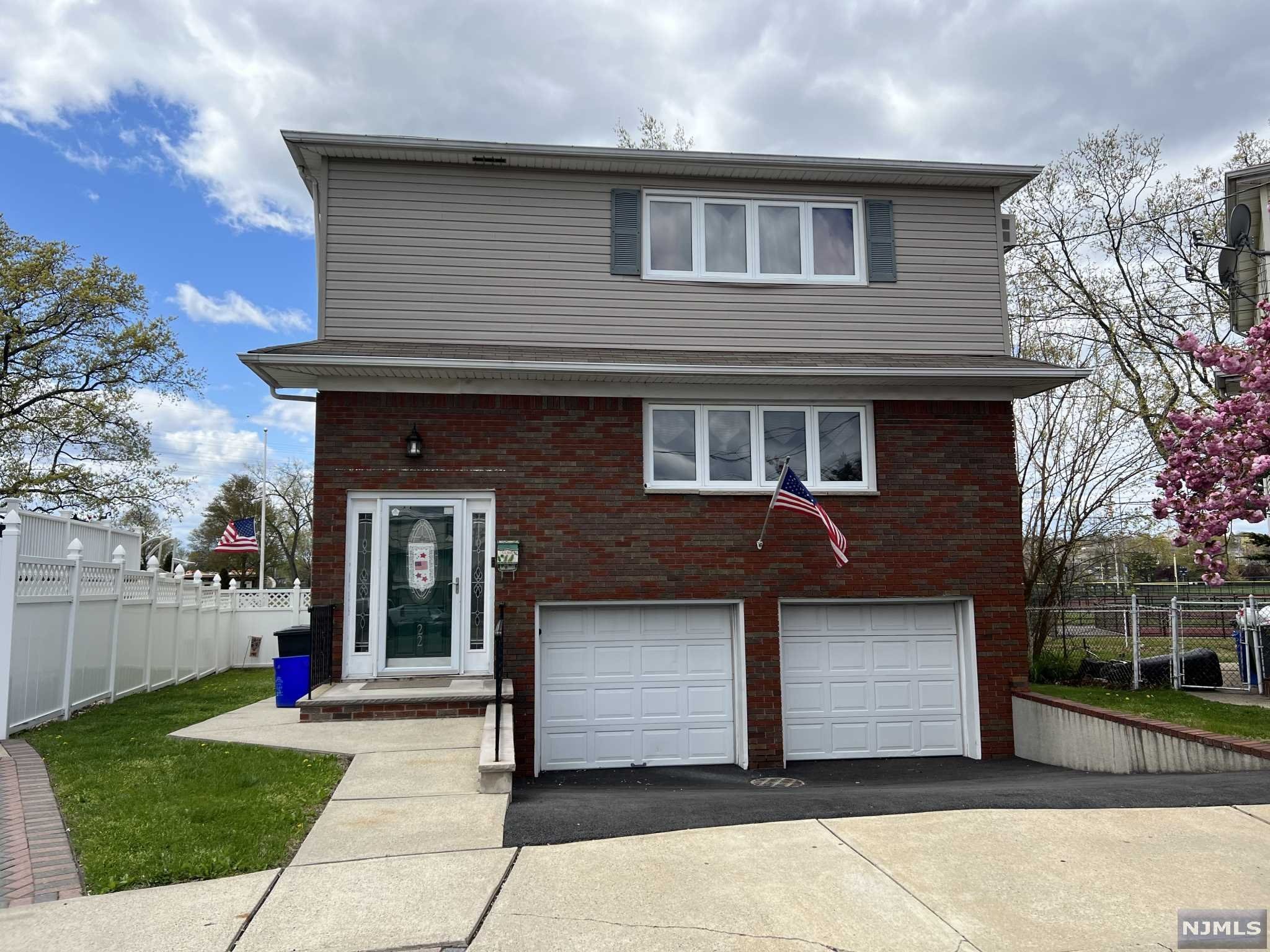 Fabulous and well maintained two family. This turn-key home is situated on a cul-de-sac with a great yard for entertaining and overlooking the park. This home offers a rear deck off first floor, hardwood flooring, spacious size rooms, newer heating systems and hot water heaters. All utilities are on main level. Ground level is finished with a family room, full bath, storage and two car garage. A must see!