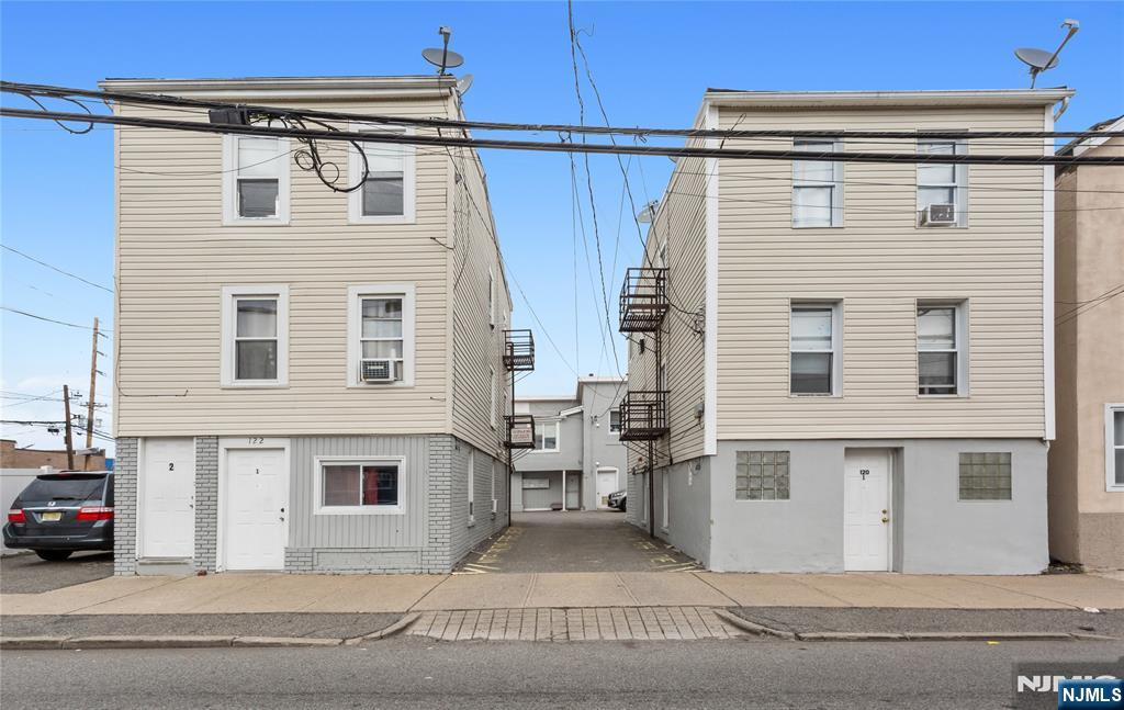 UNIQUE INVESTMENT OPPORTUNITY ! Legal 8 unit residential property located in 3 separate buildings. Three 1 bedroom 1 bath units in the one building. Three 1 bedroom 1 bath units in the second building. Two bedroom 1 bath and 3 bedroom 1 bath units in the third/rear building. Eight parking spaces in the parking lot and an additional space in the alley/driveway adjacent to building 120. All units are currently rented with leases in place. Most units with separate utilities. Close to NYC transport and shopping. A fantastic opportunity. Not to be missed !