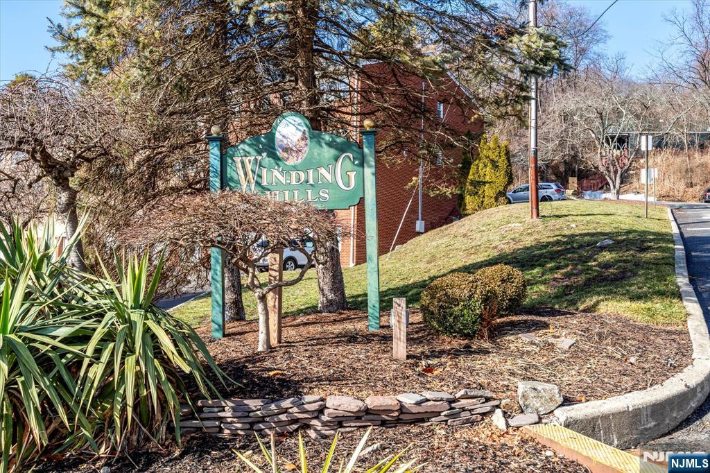 Updated second-floor 1-bedroom, 1-bath condo in the Winding Hills Condominium complex. Located at the top of the mountain, this unit offers a peaceful setting with access to walking trails throughout the community to enjoy the scenic lake views and woods. The 700 SqFt condo includes a galley kitchen with marble counter tops and and stainless steel appliances, dining area, spacious living room, bedroom with a retractable motorized projector TV screen, full bathroom with stand up shower and plenty of closets. Features include a large private storage unit and shared laundry in the basement of the F building, unassigned parking spaces and a pet-friendly complex.