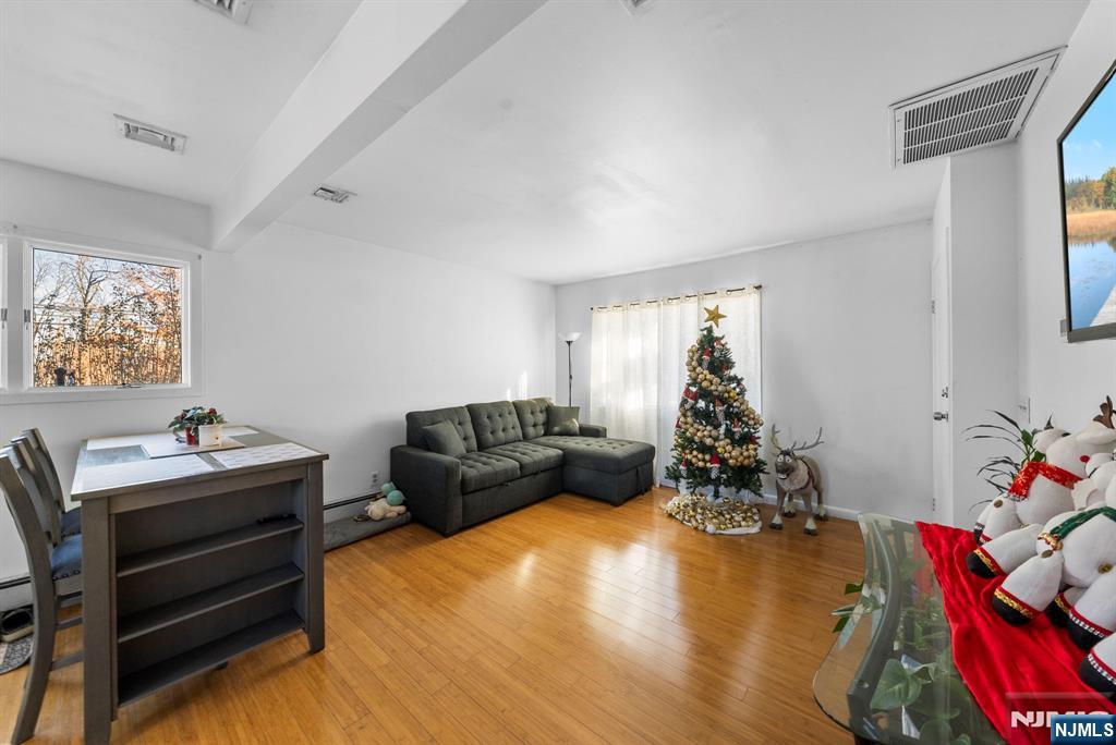 Welcome to this well-maintained two-family home in Garfield. Both units offer great space and convenience, perfect for owner occupancy or investment. Unit 1 features an open-concept living room, dining room, and kitchen with access to the deck and patio, two bedrooms, and a full bath. Unit 2 offers an open-concept living room, dining room, kitchen, bedroom, and full bath. The fully finished basement includes a large recreation room, a bonus room, a full bath, and a utility room. Generous multi-car parking is a rare and valuable feature providing extra comfort and flexibility. Come and see all that this property has to offer.