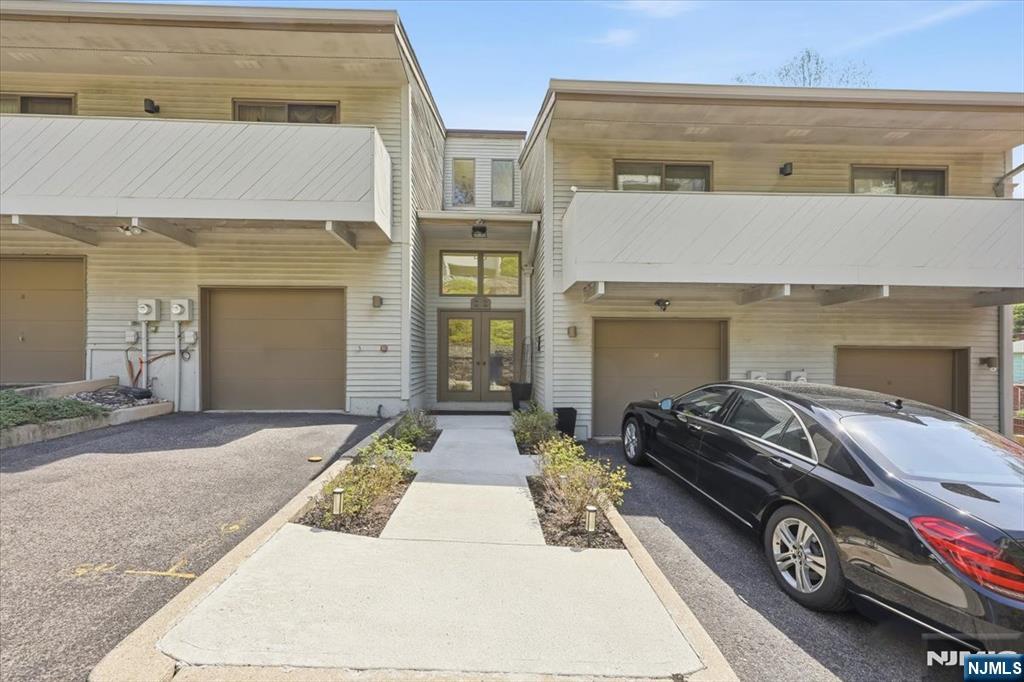 Spacious 3BR/3BA townhouse in the heart of Clifton. Features high ceilings in the living and dining rooms, fireplace, and open layout. Private balconies off the living room and two bedrooms. Primary suite includes a large walk-in closet. Finished walk-out lower level with family room, bedroom, full bath, and patio accessâ€”ideal for guests or extended living. Includes garage plus two additional parking spaces. Conveniently located near shopping, dining, and transportation. *** HOA - will be $567/month after closing to a new owner.