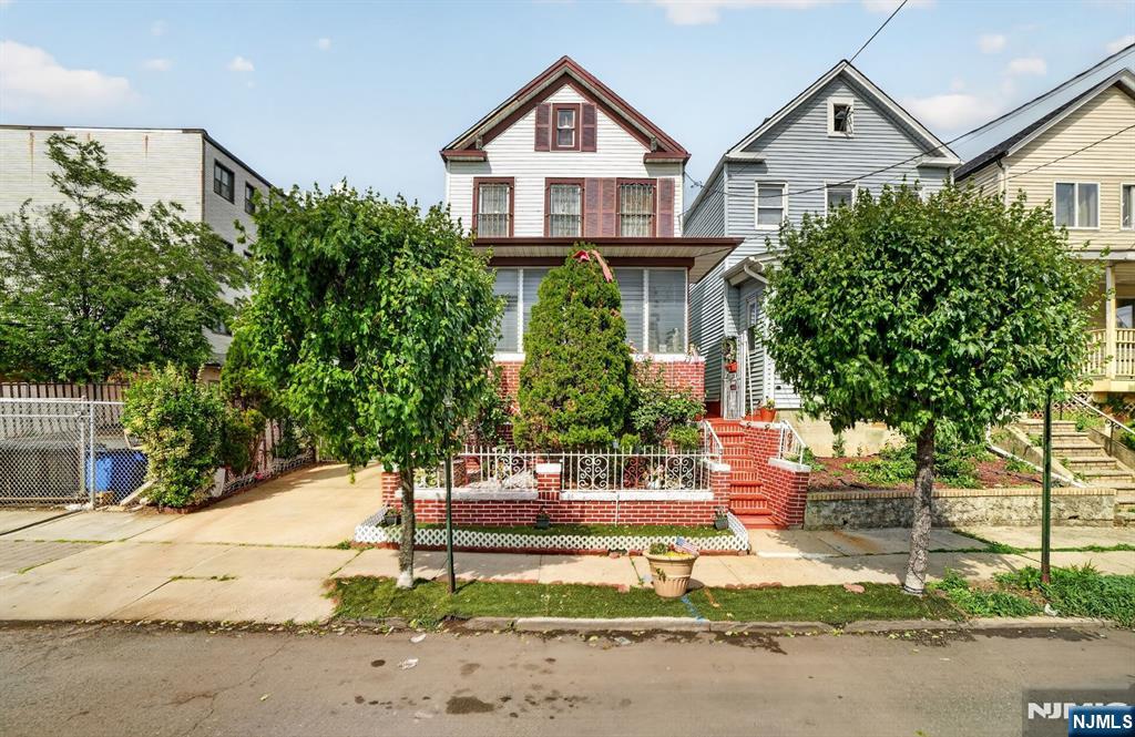 Welcome to this well-maintained single-family home in Elizabeth! The first floor features a spacious living room, dining room, bedroom and a full bathroom. The second floor offers 3 generously sized bedrooms. A finished attic provides additional versatile living space, perfect for a home office, recreation room. The basement includes an open space and a dedicated laundry room, offering plenty of storage and functionality. Exterior features include a detached 3-car garage and a driveway with 2 additional parking spaces (1-car width). Conveniently located near shopping, dining, schools, public transportation, and major highways. Don't miss this opportunity!