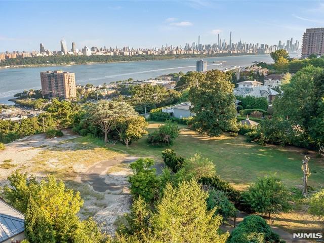 Build a family-compound or a Majestic Mansion with direct Hudson River/NYC views; situated directly on the peak of the East Palisades Cliffs. Located within the highly desirable East-Palisade Section of Fort Lee; this vacant 50,368 sq.ft.Lot IS APPROVED for 3 Single Family Residential Homes.