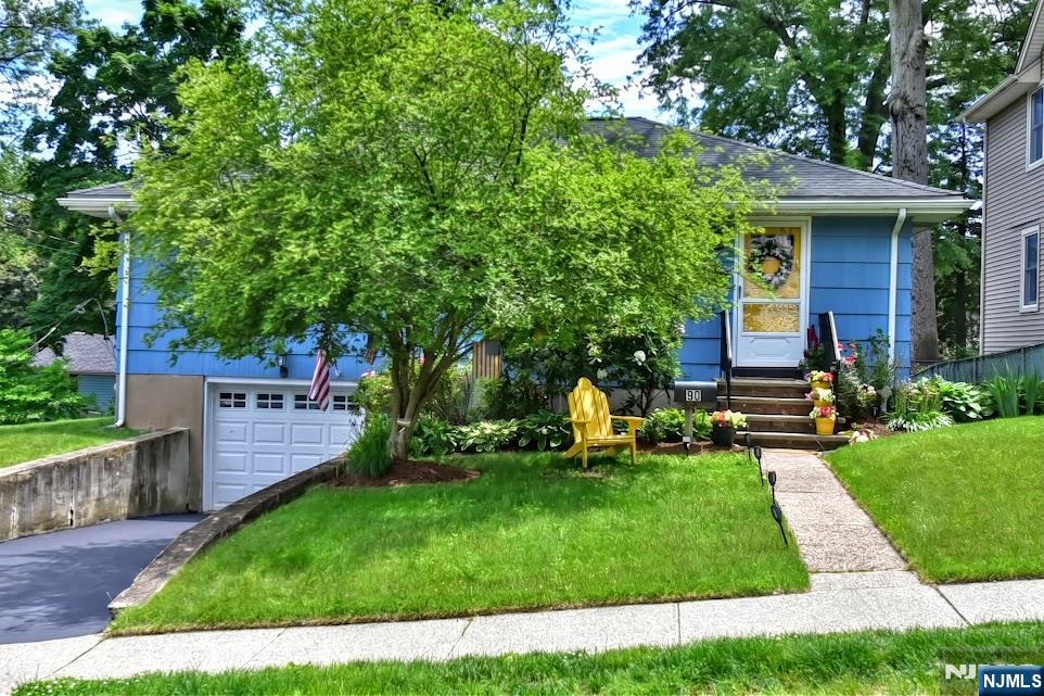 This is a great two bedroom ranch. It is in pristine condition with gleaming hardwood floors. A very bright living room that opens up to the kitchen and dining room. There are sliding doors that lead out to the patio with a fenced in yard. It has two main bedrooms on the main level and one full bathroom. It comes with a cozy finished basement that has a full bathroom, storage, and utility room. A door that leads to the one car garage underneath the house.