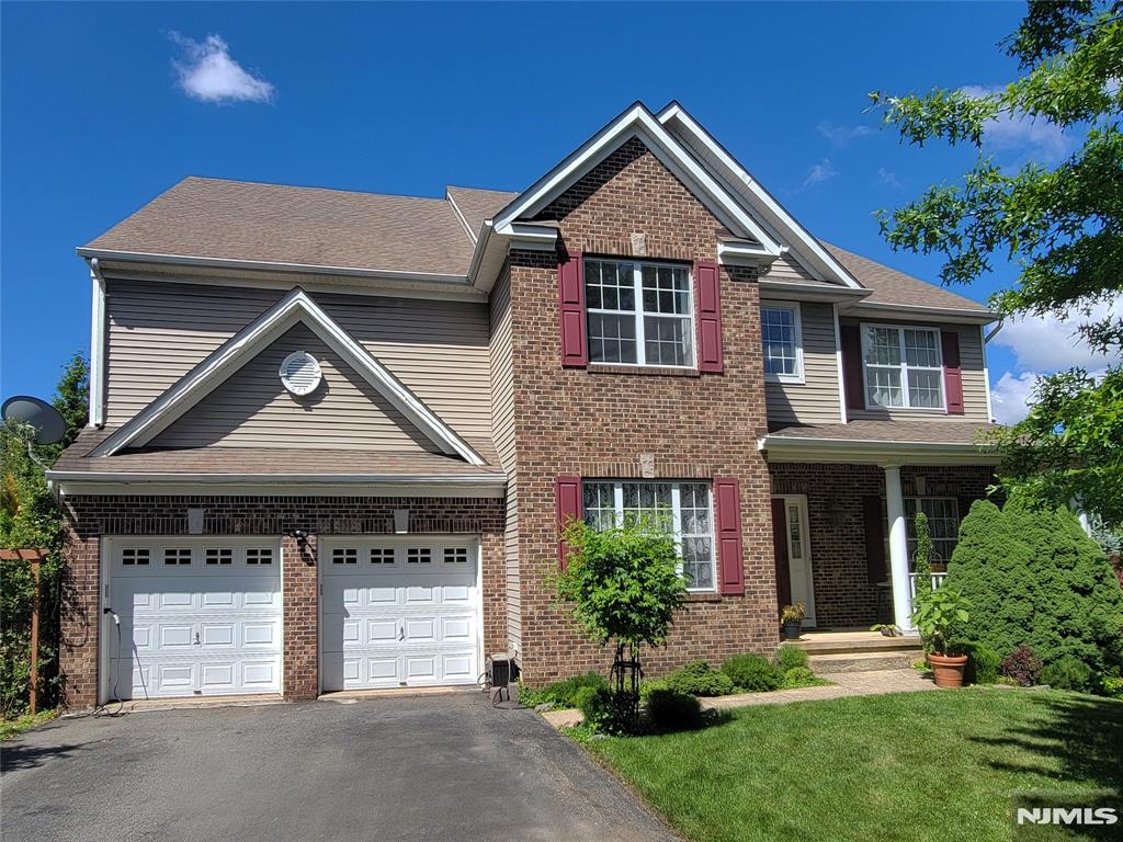 Welcome to this stunning Colonial home in the highly desirable The Peaks community of Lake Hopatcong in Jefferson Twp. Nestled at the beginning of a quiet cul-de-sac, it offers elegance, comfort, & year-round spectacular lake views. Bathed in natural light, it features an open & spacious floor plan designed for everyday living & entertaining. The large open-concept KITCHEN offers a center island, generous dining area, abundant cabinetry, & direct access to a deck w/breathtaking lake views & sunsets. A formal DINING ROOM, LIVING ROOM, & HOME OFFICE provide flexibility for remote work. The impressive FAMILY ROOM showcases a cathedral ceiling & expansive windows, creating an airy & inviting atmosphere. A dual staircase leads to the 2nd floor, enhancing the sense of space & sophistication. Upstairs, the spacious PRIMARY SUITE features 2 walk-in closets & an en-suite BATHROOM w/a jetted tub, oversized shower, & separate water closet. 3 additional BEDROOMS, a full BATHROOM, & a LAUNDRY ROOM complete this level. The walk-out BASEMENT w/SAUNA & GYM offers versatile space for wellness, recreation, & storage. Outside, a beautifully landscaped garden creates a private outdoor oasis. An oversized 2-car GARAGE provides extra storage space. Ideally located w/convenient access to major highways, this home offers an easy commute to NYC. Most furniture & selected household items may be included for a seamless move-in. This is a rare opportunity to own such a spectacular home. A must-see!