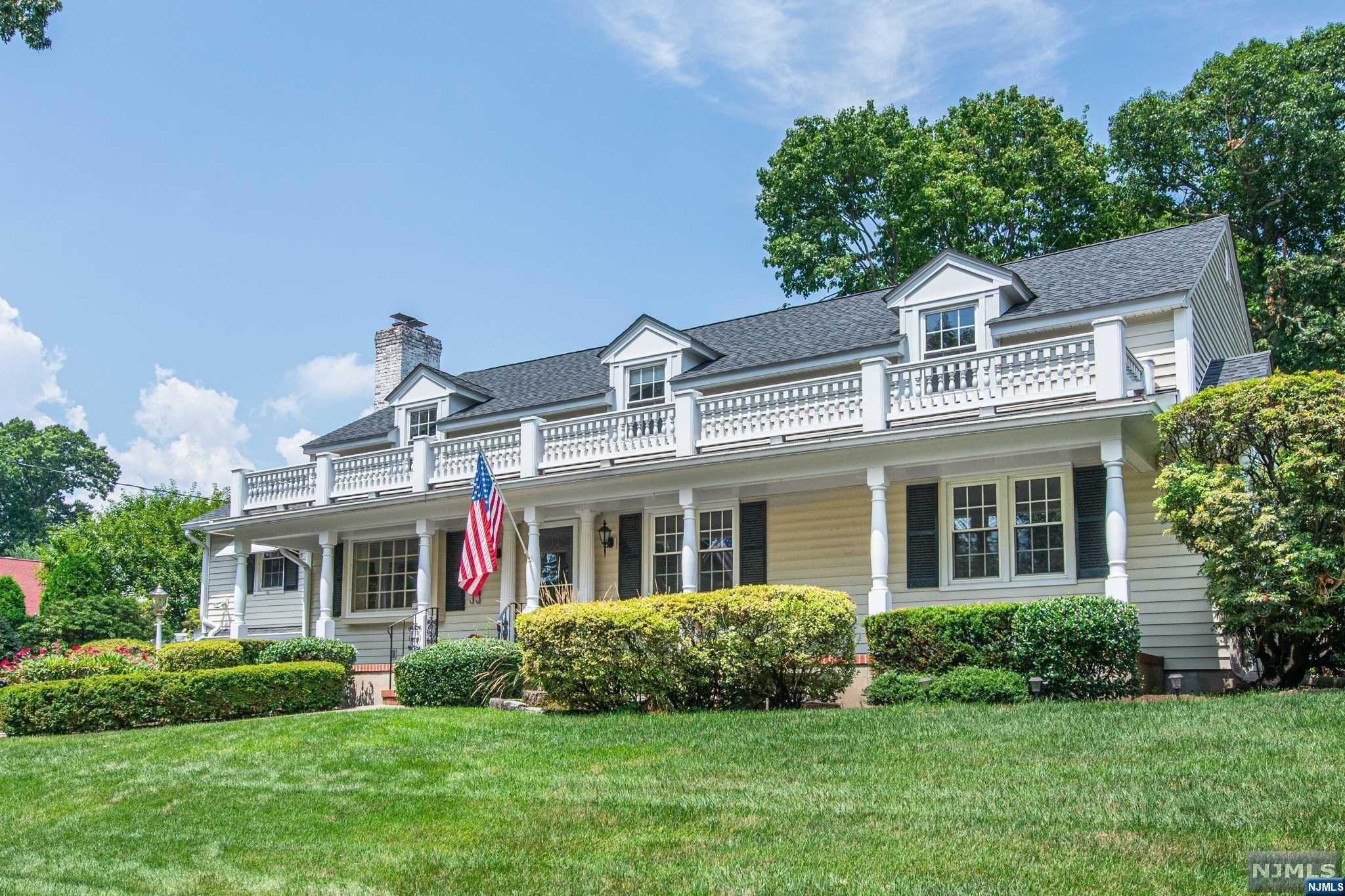 Prepare to Fall in LOVE with this Iconic Midland Park home that exudes Grandeur and Charm located on one the best streets in Town. The Covered Porch and Columns welcome you into this 4 BR 3.5 bath Custom Built home offered by Original Owners. The main level is light and bright with an open flow from living room, dining room to kitchen. Relax or entertain family and friends in the cozy family room or in the Sunroom (heated) with Floor to ceiling windows that overlooks the secluded, spacious backyard. Also on the main level is a bedroom with 1/2 bath, BR/Office and full bath. Upstairs you will find 2 Huge Ensuites with a shared WIC and Hardwood under carpets. The basement is part finished and has 2 cedar closets and plenty of storage w/steps to the garage. Amenities inc Newer roof and windows, Hardwood floors, custom kitchen, built-ins and so much more! Make this home yours today!